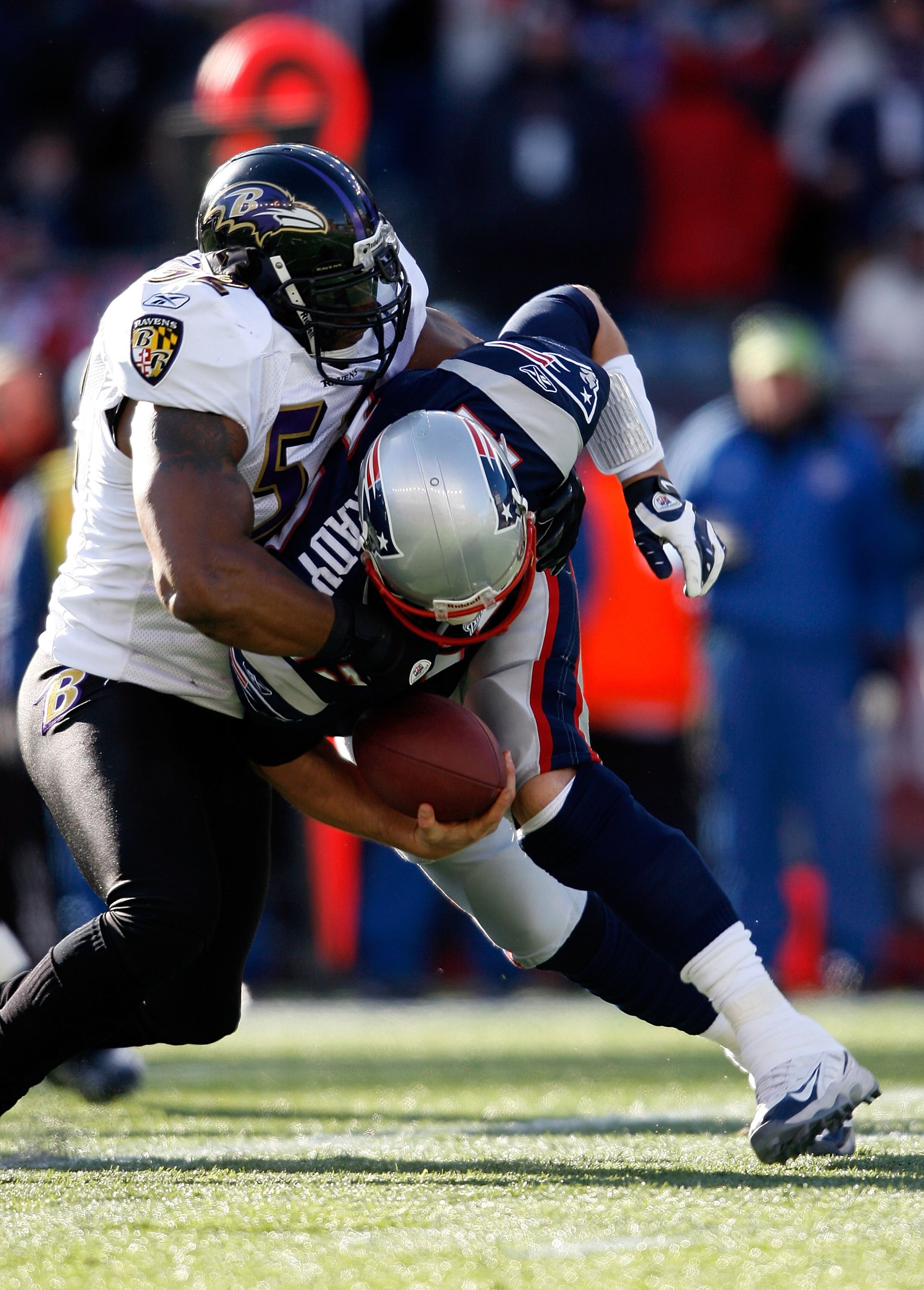 FOXBORO, MA - JANUARY 10:  Tom Brady #12 of the New England Patriots is sacked by Ray Lewis #52 of the Baltimore Ravens during the 2010 AFC wild-card playoff game at Gillette Stadium on January 10, 2010 in Foxboro, Massachusetts. The Ravens won 33-14. (Ph