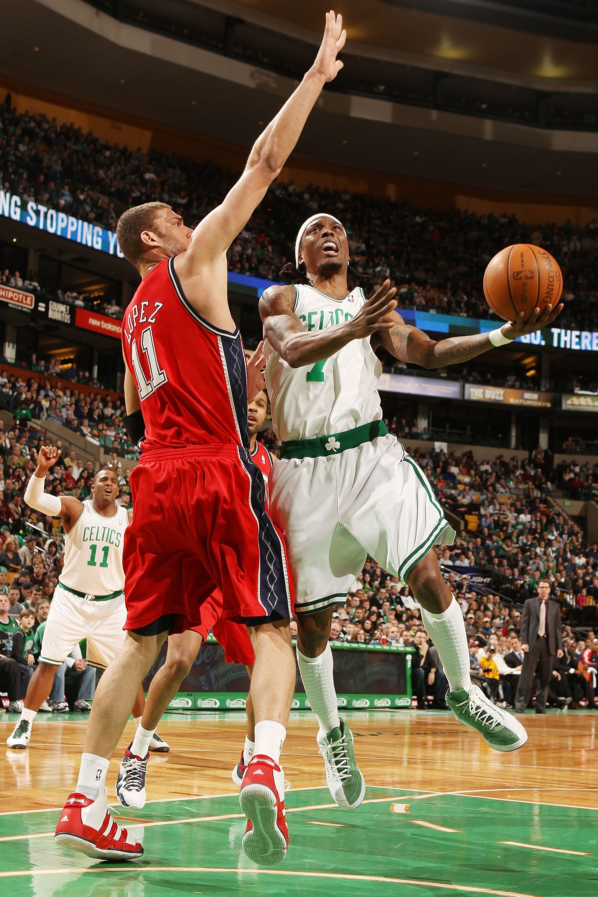 BOSTON - FEBRUARY 27:  Marquis Daniels #7 of the Boston Celtics heads for the net as Brook Lopez #11 of the New Jersey Nets defends at the TD Garden on February 27, 2010 in Boston, Massachusetts. The Nets defeated the Celtics 104-96.  NOTE TO USER: User e