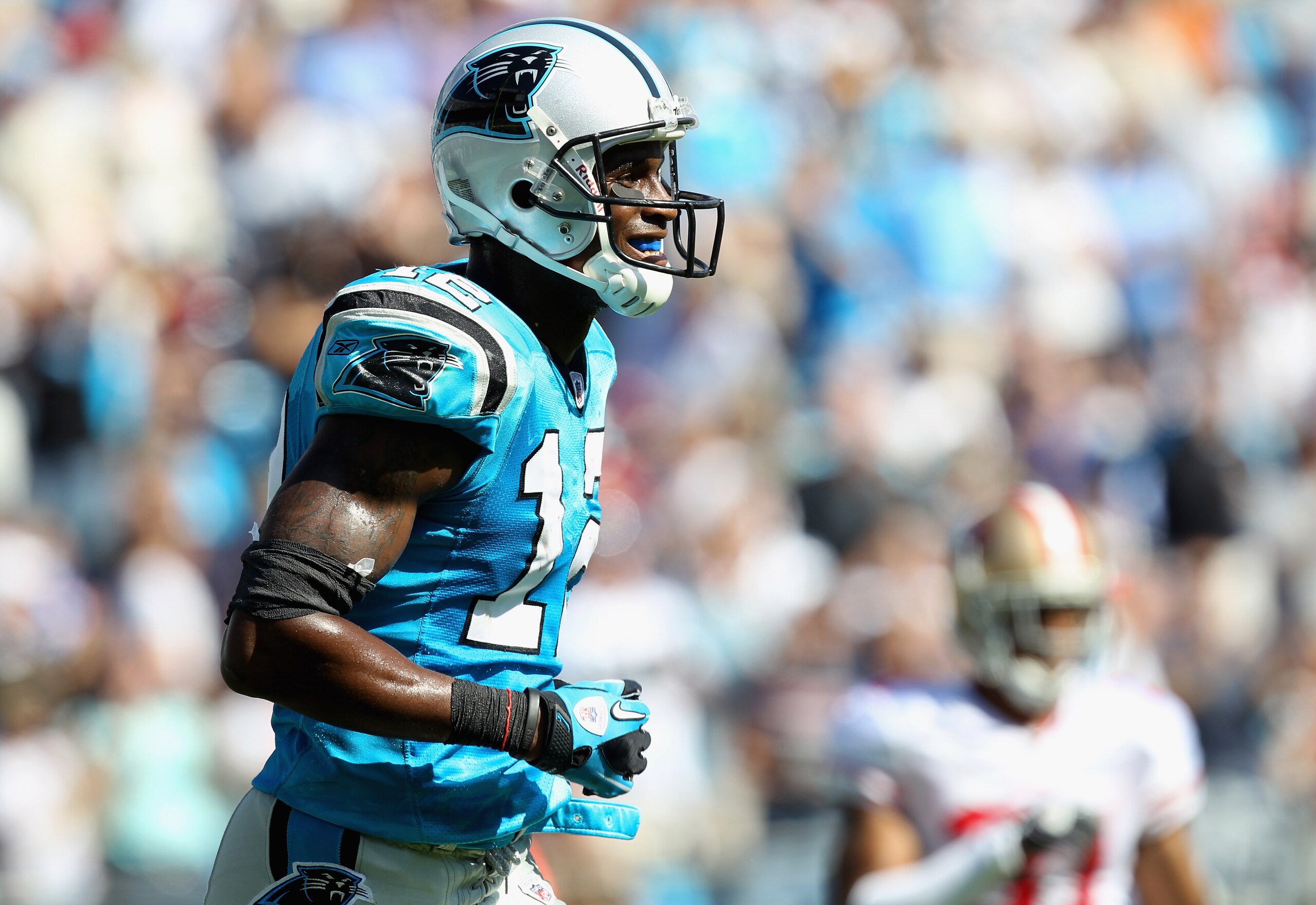 CHARLOTTE, NC - OCTOBER 24:  David Gettis #12 of the Carolina Panthers smiles after scoring a touchdown against the San Francisco 49ers during their game at Bank of America Stadium on October 24, 2010 in Charlotte, North Carolina.  (Photo by Streeter Leck