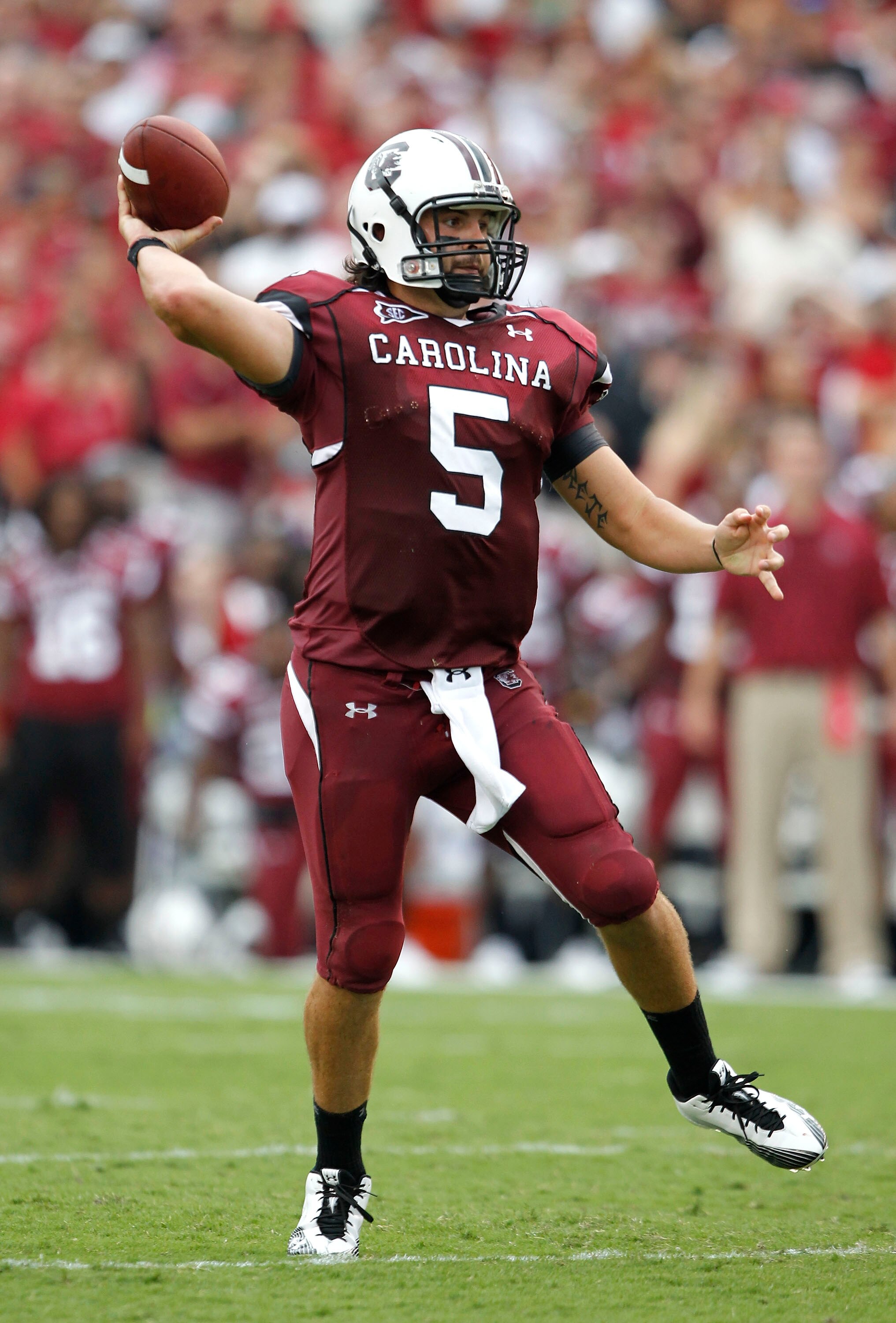 COLUMBIA, SC - SEPTEMBER 11:  Quarterback Steven Garcia #5 of the South Carolina Gamecocks rolls out and throws a pass during the game against the Georgia Bulldogs at Williams-Brice Stadium on September 11, 2010 in Columbia, South Carolina.  The Gamecocks