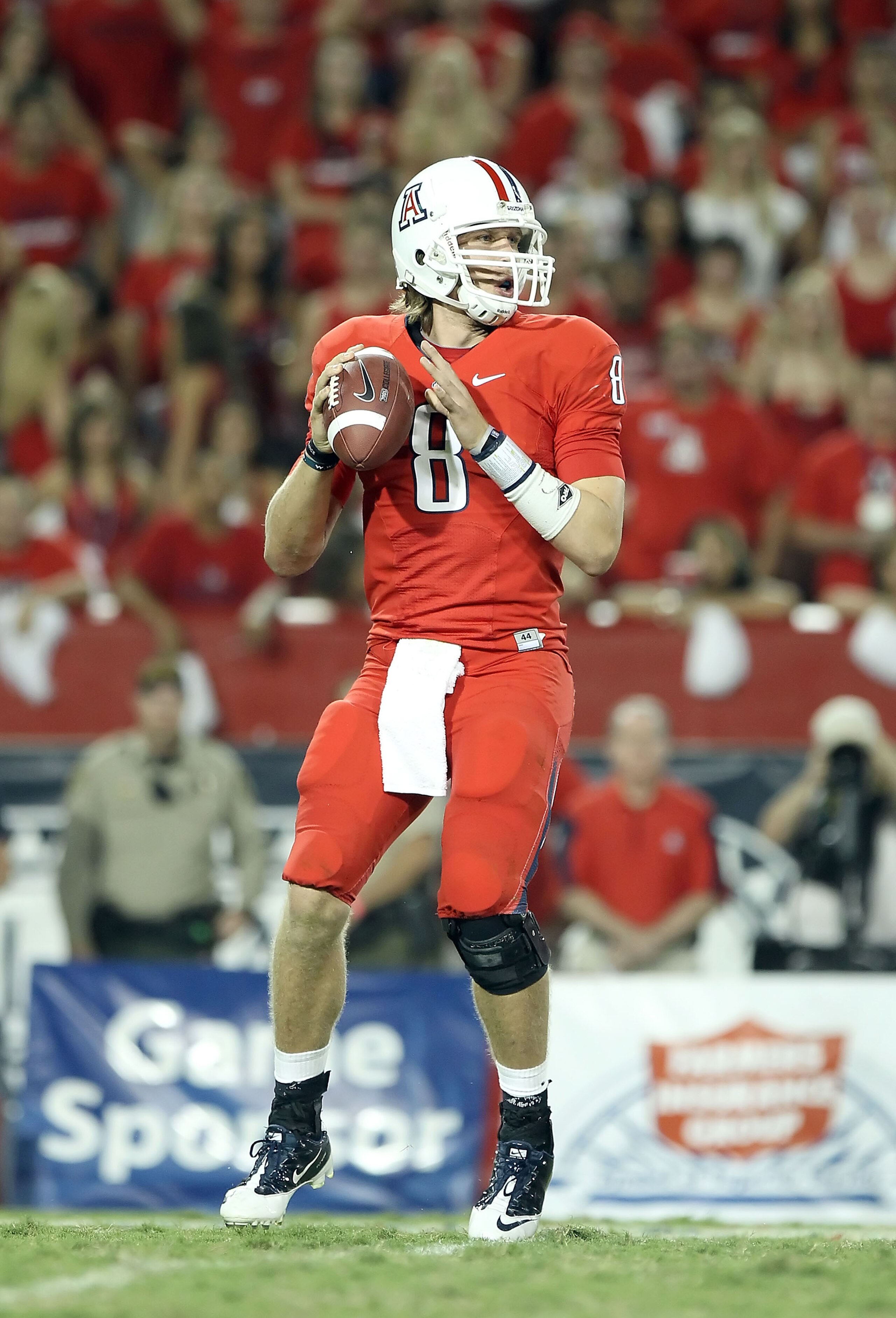 TUCSON, AZ - SEPTEMBER 18:  Quarterback Nick Foles #8 of the Arizona Wildcats drops back to pass during the college football game against the Iowa Hawkeyes at Arizona Stadium on September 18, 2010 in Tucson, Arizona. The Wildcats defeated the Hawkeyes 34-
