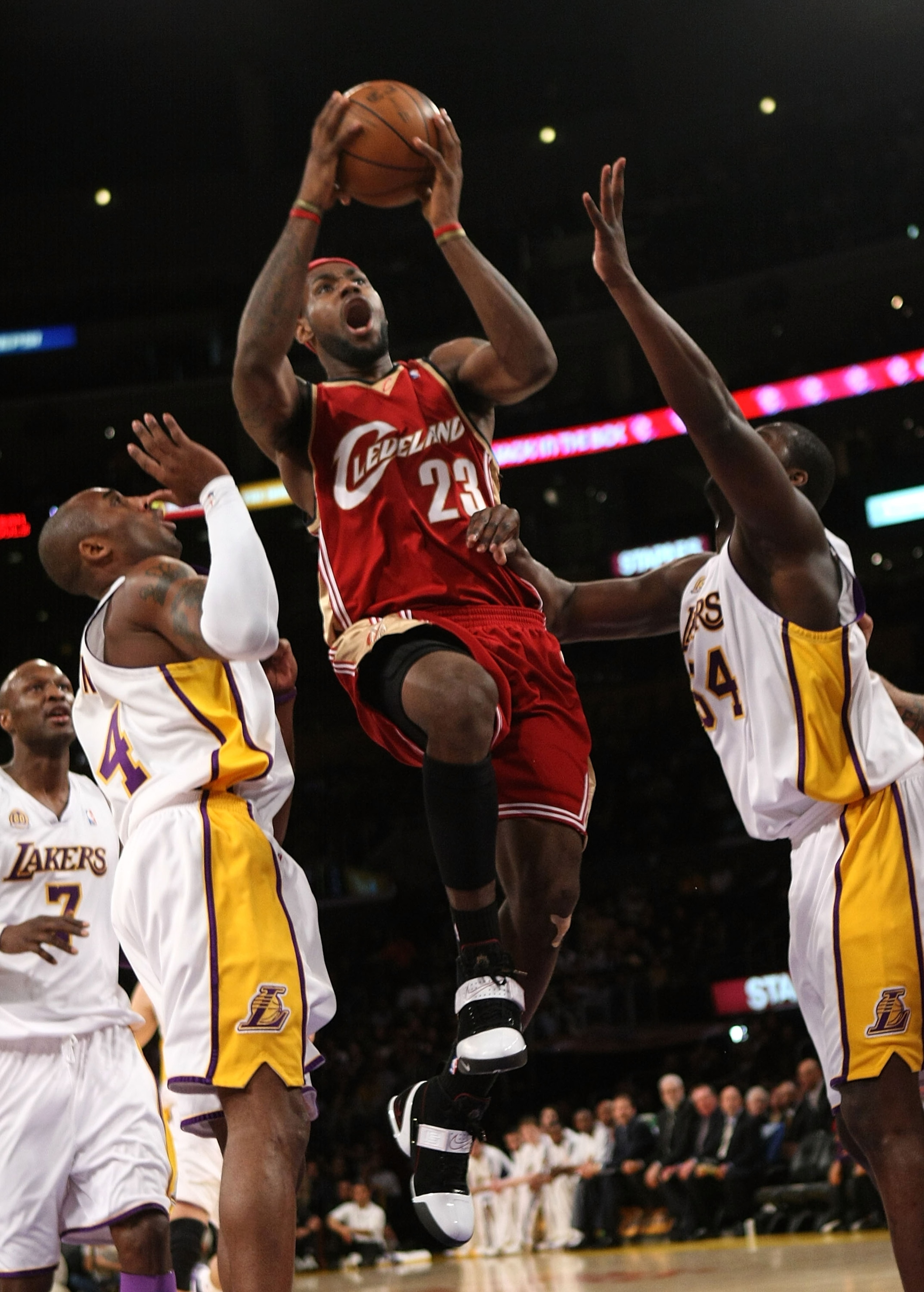 LOS ANGELES - JANUARY 27:  LeBron James #23 of the Cleveland Cavaliers goes up for a shot between Kobe Bryant #24 and Kwame Brown #54 of the Los Angeles Lakers at Staples Center January 27, 2008 in Los Angeles, California.   NOTE TO USER: User expressly a