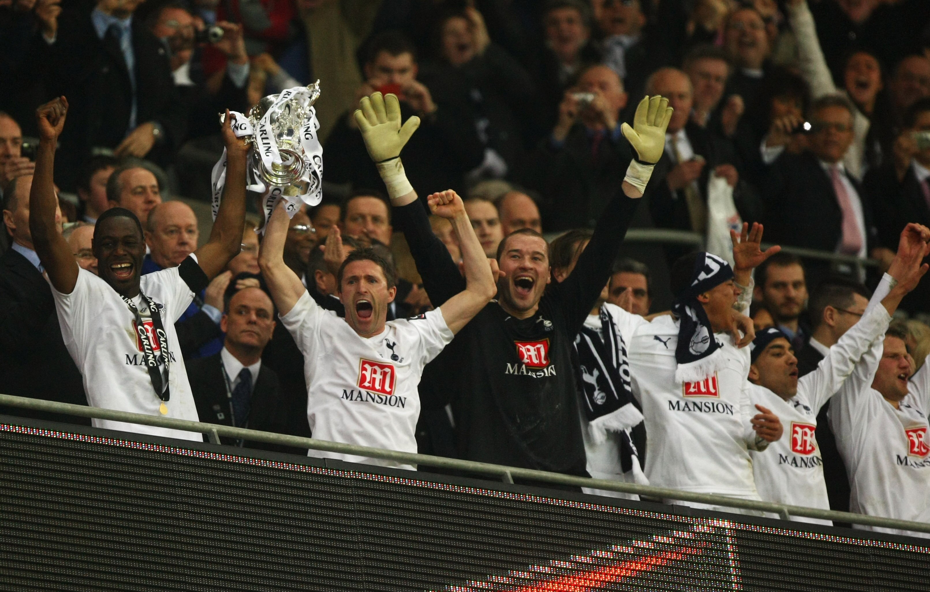 LONDON - FEBRUARY 24:  Captain Ledley King of Tottenham Hotspur (L) lifts the trophy with Robbie Keane following victory during the Carling Cup Final between Tottenham Hotspur and Chelsea at Wembley Stadium on February 24, 2008 in London, England. Tottenh