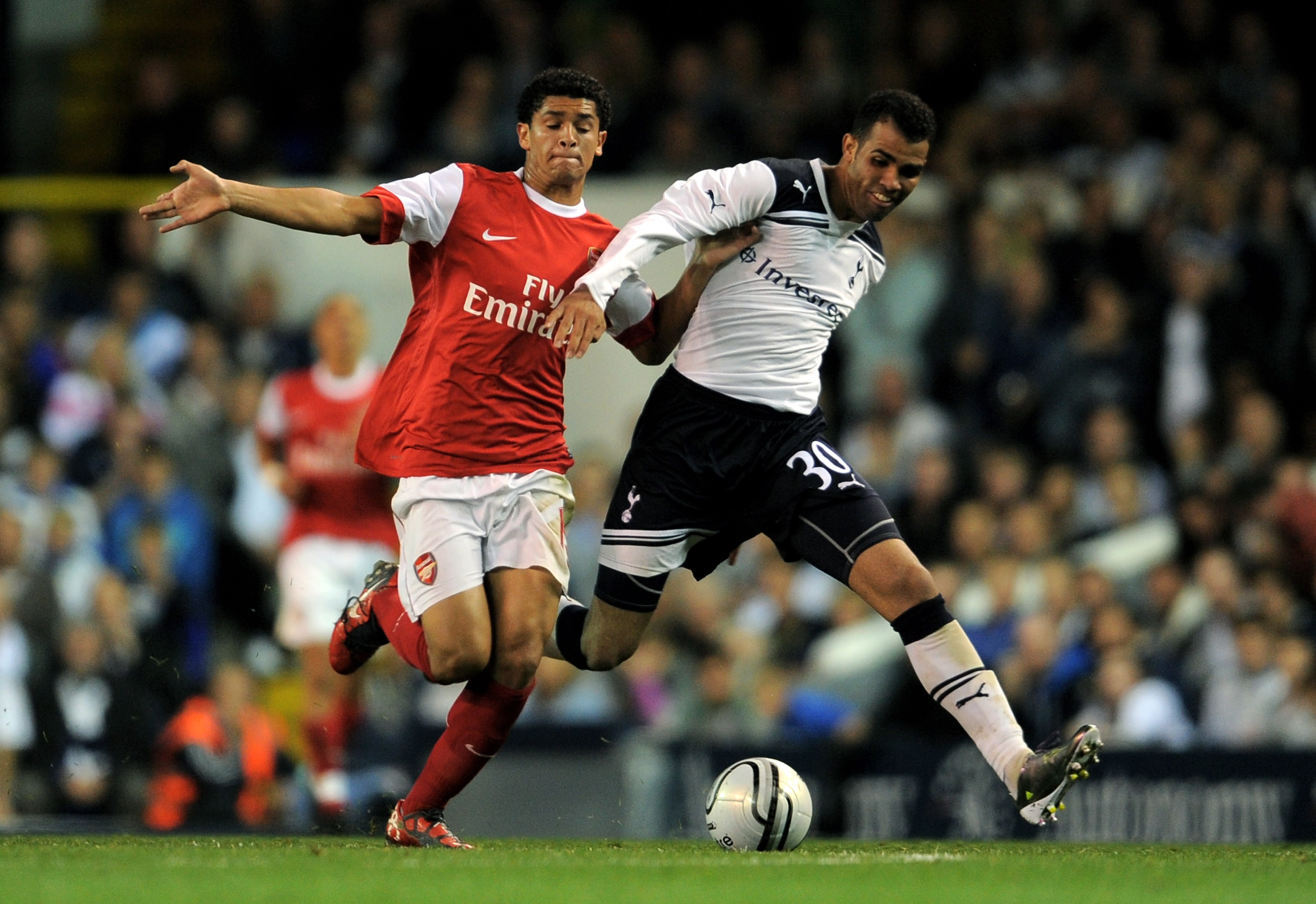 LONDON, ENGLAND - SEPTEMBER 21:  Denilson (L) of Arsenal and Sandro (R) of Spurs battle for the ball during the Carling Cup third round match between Tottenham Hotspur and Arsenal at White Hart Lane on September 21, 2010 in London, England.  (Photo by Mic