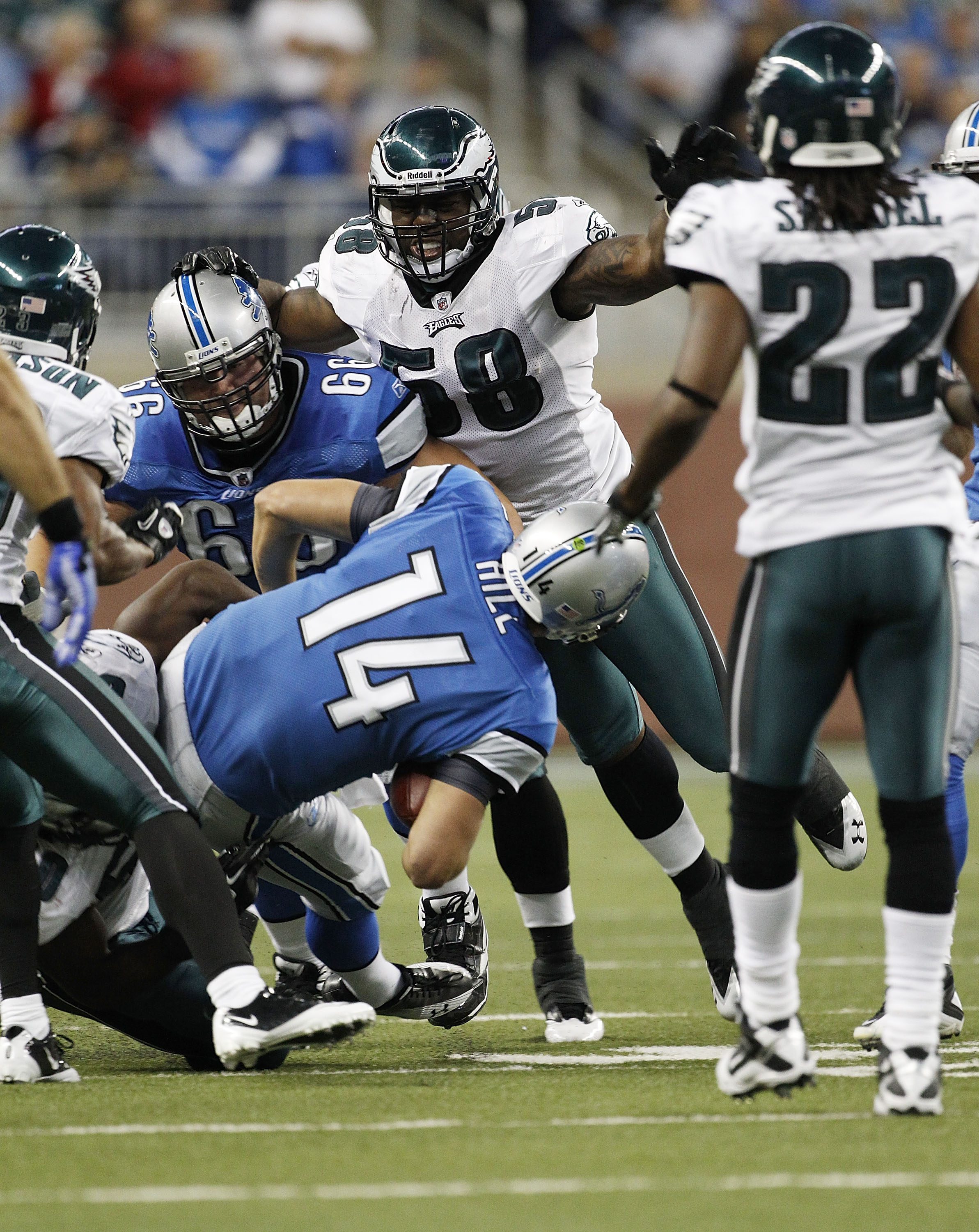 DETROIT - SEPTEMBER 19:  Shaun Hill #14 of the Detroit Lions is sacked by Ernie Sims #50 during the game against the Philadelphia Eagles at Ford Field on September 19, 2010 in Detroit, Michigan. The Eagles defeated the Lions 35-32.  (Photo by Leon Halip/G