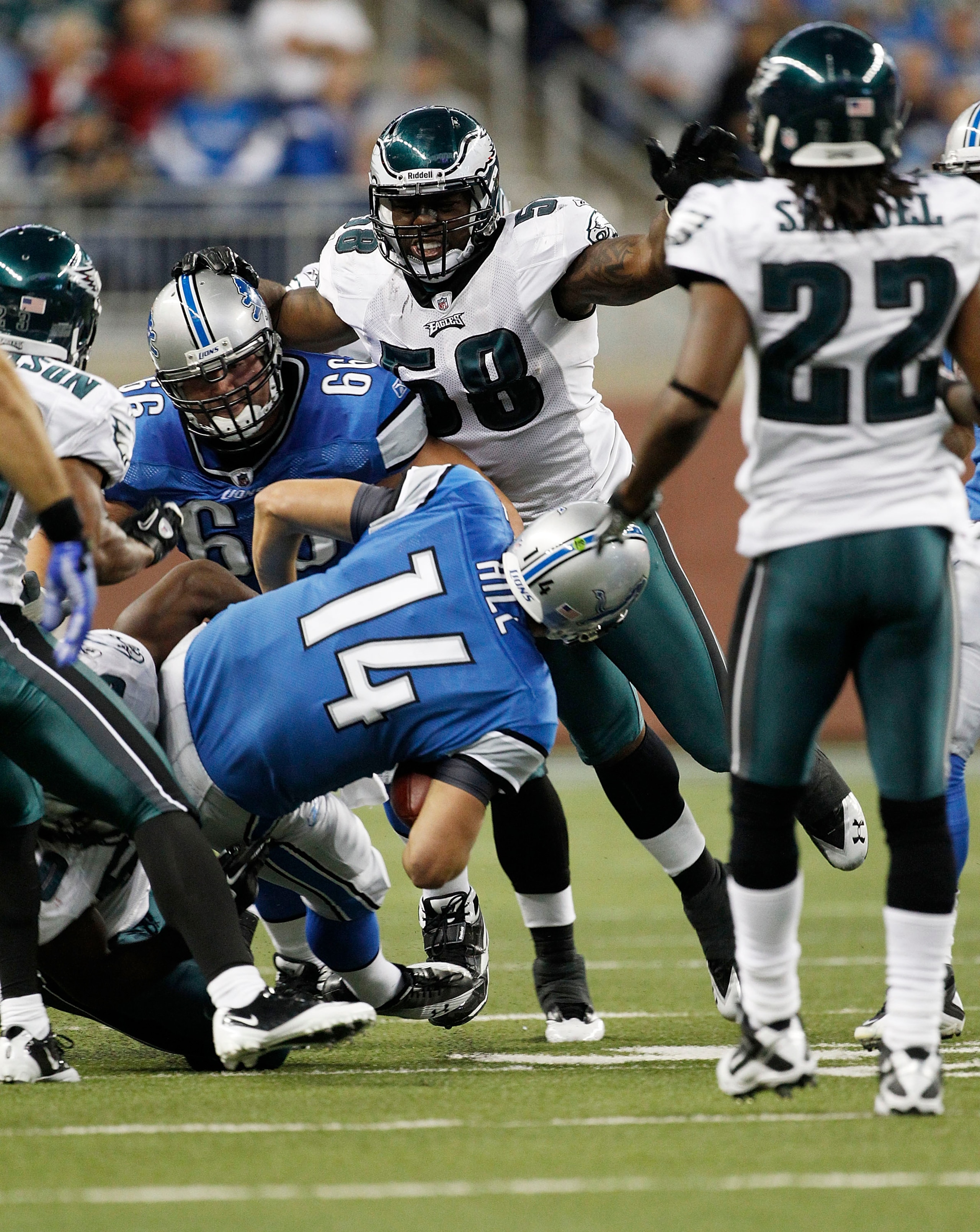 DETROIT - SEPTEMBER 19:  Shaun Hill #14 of the Detroit Lions is sacked by Ernie Sims #50 during the game against the Philadelphia Eagles at Ford Field on September 19, 2010 in Detroit, Michigan. The Eagles defeated the Lions 35-32.  (Photo by Leon Halip/G
