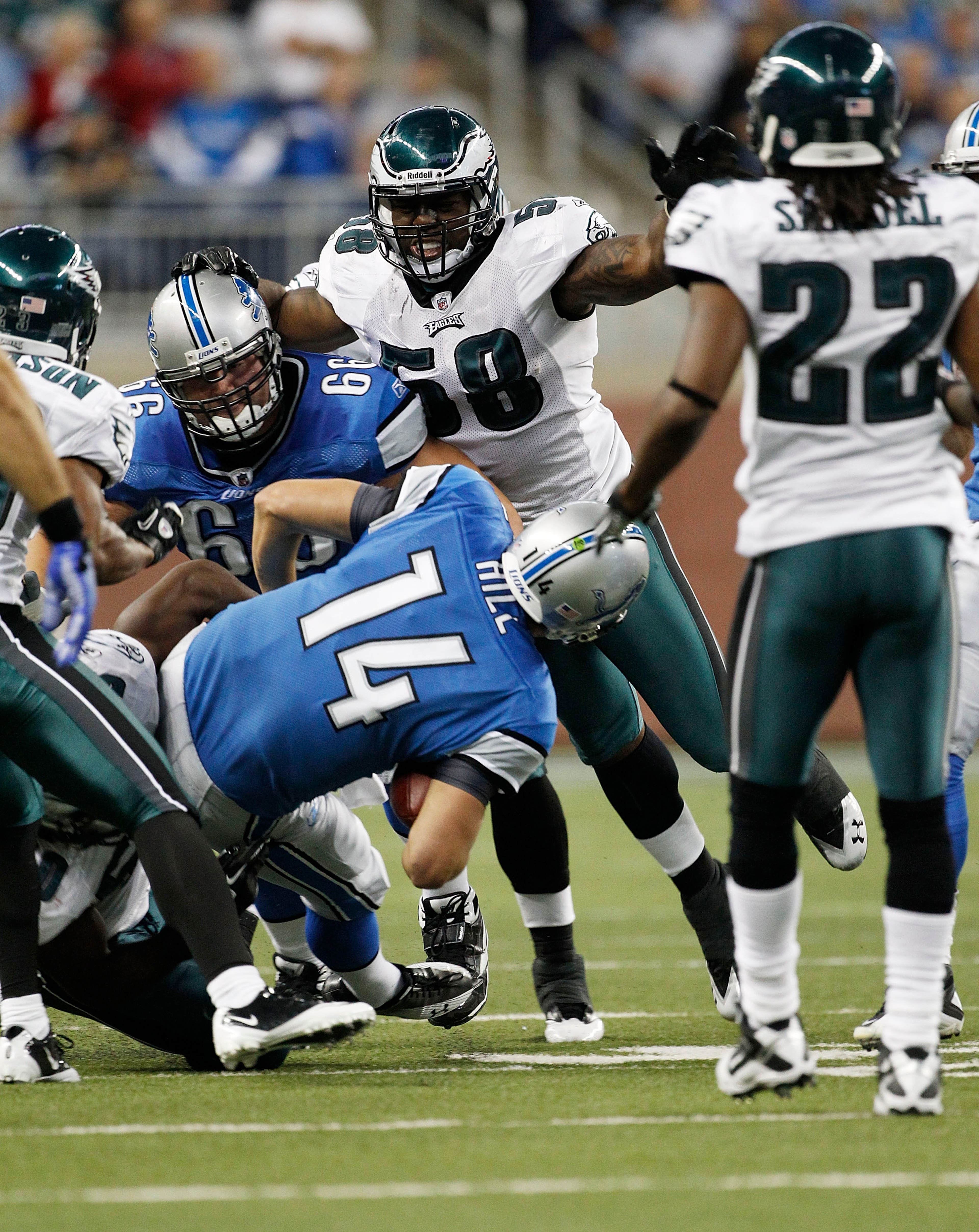 DETROIT - SEPTEMBER 19:  Shaun Hill #14 of the Detroit Lions is sacked by Ernie Sims #50 during the game against the Philadelphia Eagles at Ford Field on September 19, 2010 in Detroit, Michigan. The Eagles defeated the Lions 35-32.  (Photo by Leon Halip/G