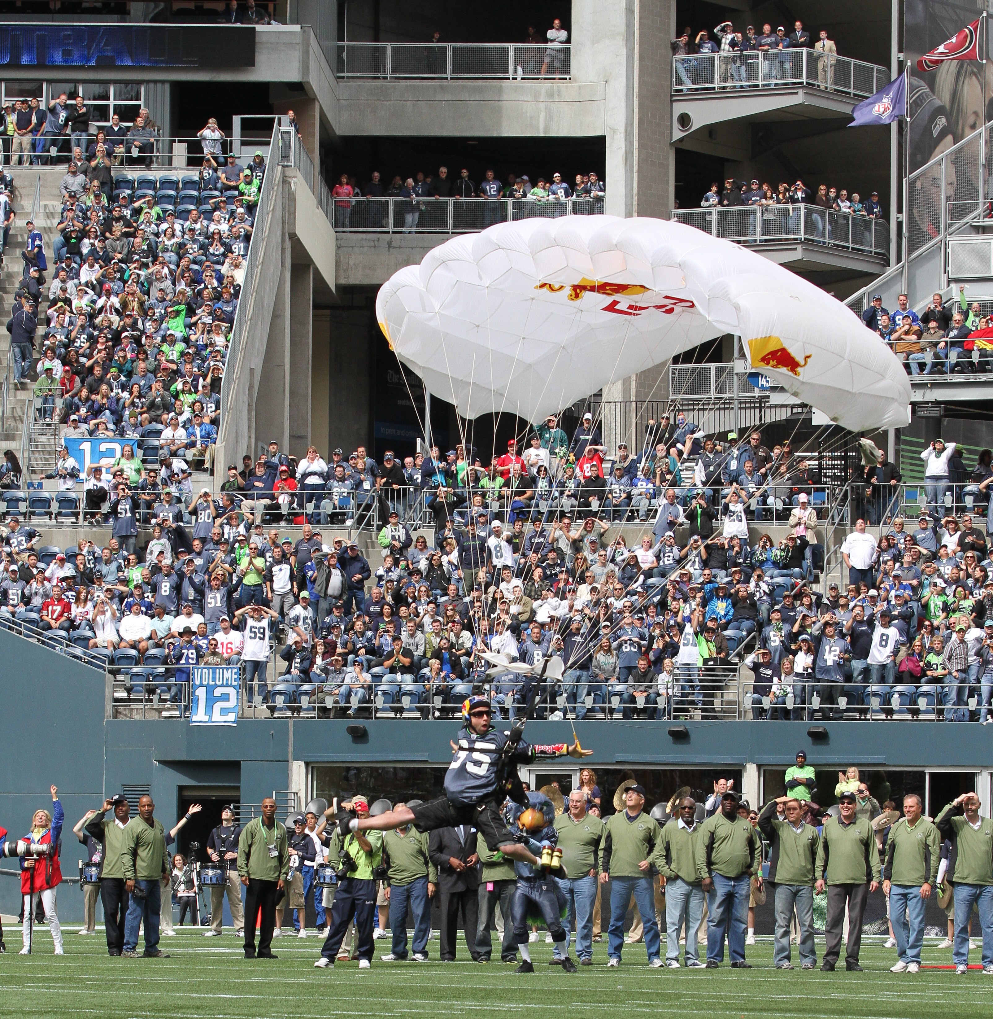 SEATTLE - SEPTEMBER 12:  A parachutist lands on the field as part of pregame ceremonies prior to the NFL season opener between the Seattle Seahawks and the San Francisco 49ers at Qwest Field on September 12, 2010 in Seattle, Washington. (Photo by Otto Gre