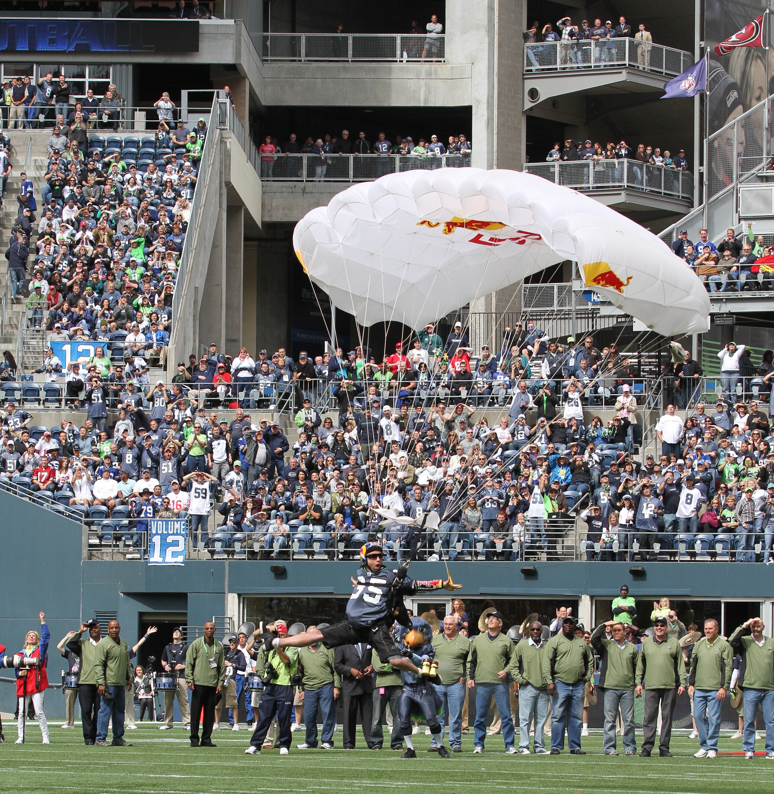 SEATTLE - SEPTEMBER 12:  A parachutist lands on the field as part of pregame ceremonies prior to the NFL season opener between the Seattle Seahawks and the San Francisco 49ers at Qwest Field on September 12, 2010 in Seattle, Washington. (Photo by Otto Gre