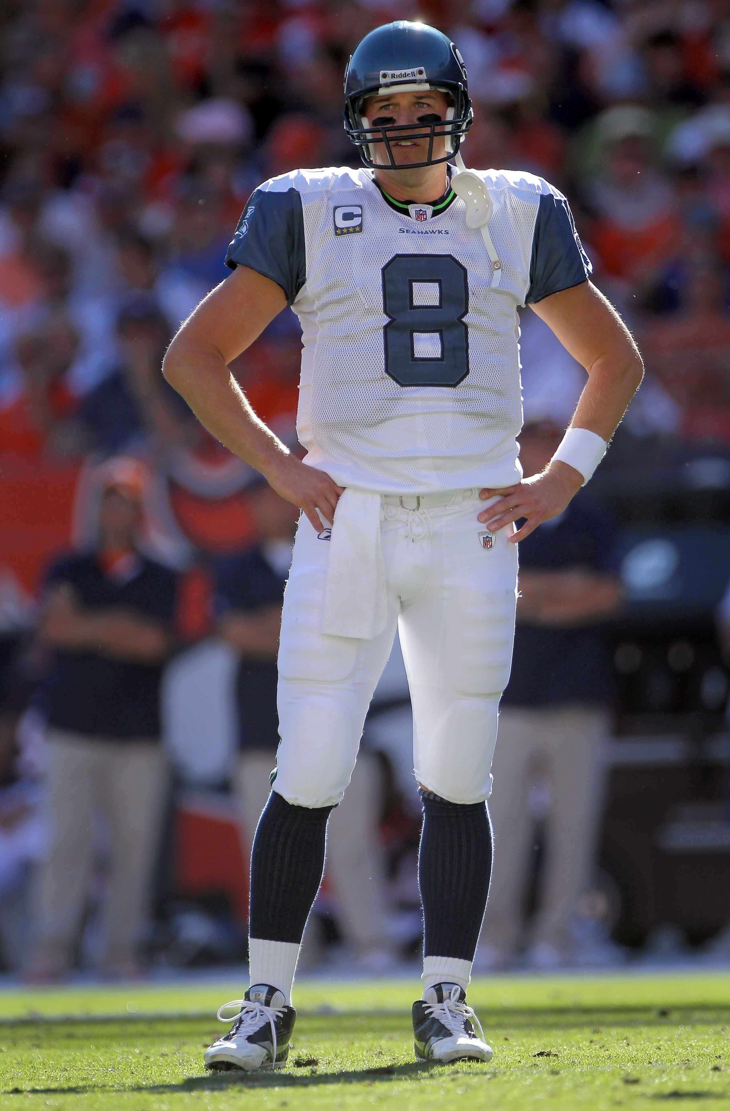 DENVER - SEPTEMBER 19:  Quarterback Matt Hasselbeck #8 of the Seattle Seahawks looks on during a break in the action against the Denver Broncos at INVESCO Field at Mile High on September 19, 2010 in Denver, Colorado. The Broncos defeated the Seahawks 31-1