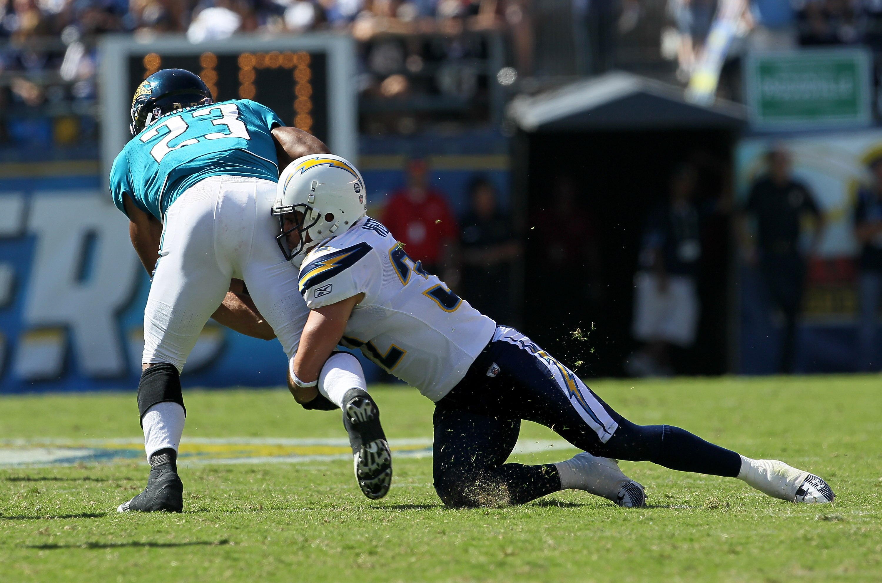 SAN DIEGO - SEPTEMBER 19:  Safety Eric Weddle #32 of the San Diego Chargers tackles running back Rashad Jennings #23 of the Jacksonville Jaguars at Qualcomm Stadium on September 19, 2010 in San Diego, California.   The Chargers won 38-13.  (Photo by Steph
