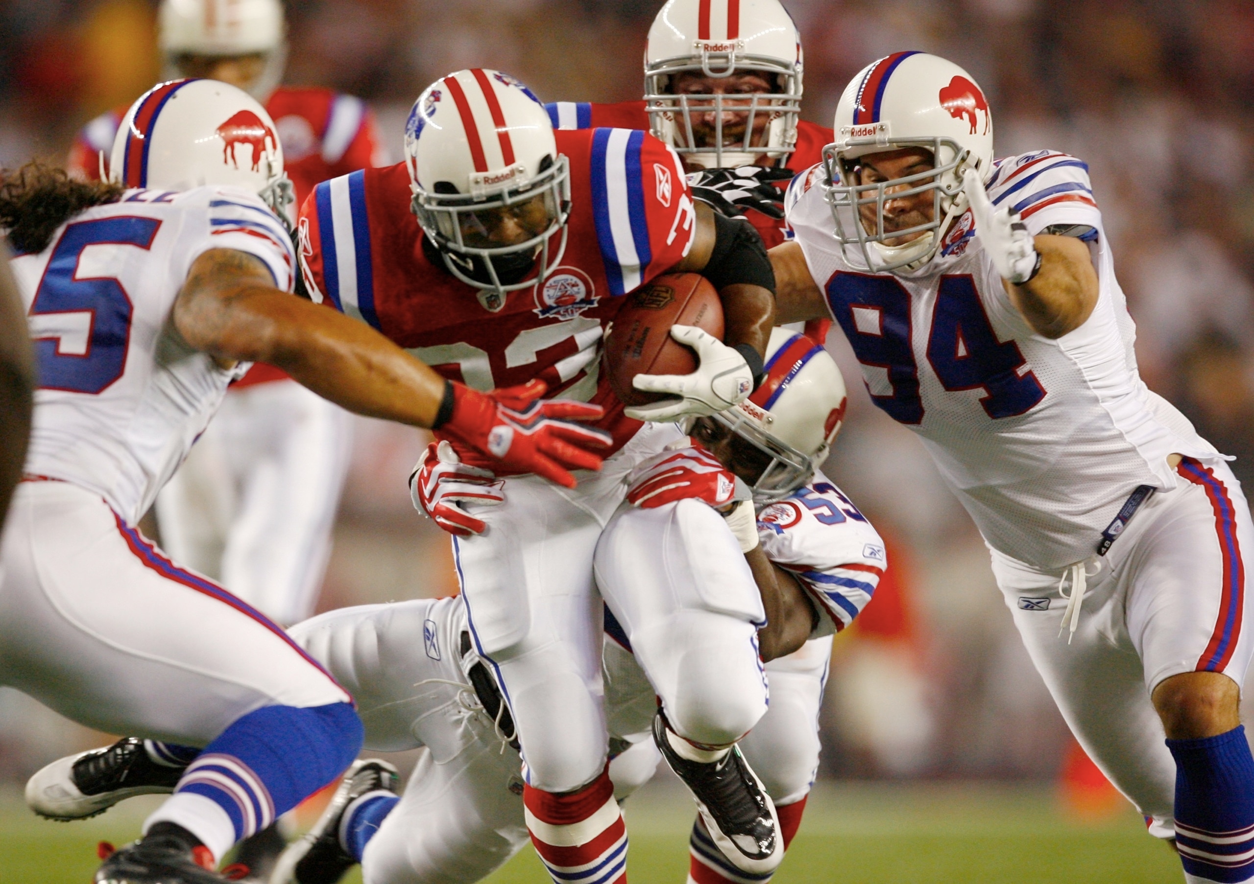 FOXBORO, MA - SEPTEMBER 14:  Running back Kevin Faulk #33 of the New England Patriots tries to break through the Buffalo Bills defense during the second quarter on September 14, 2009 at Gillette Stadium in Foxboro, Massachusetts. (Photo by Jim Rogash/Gett