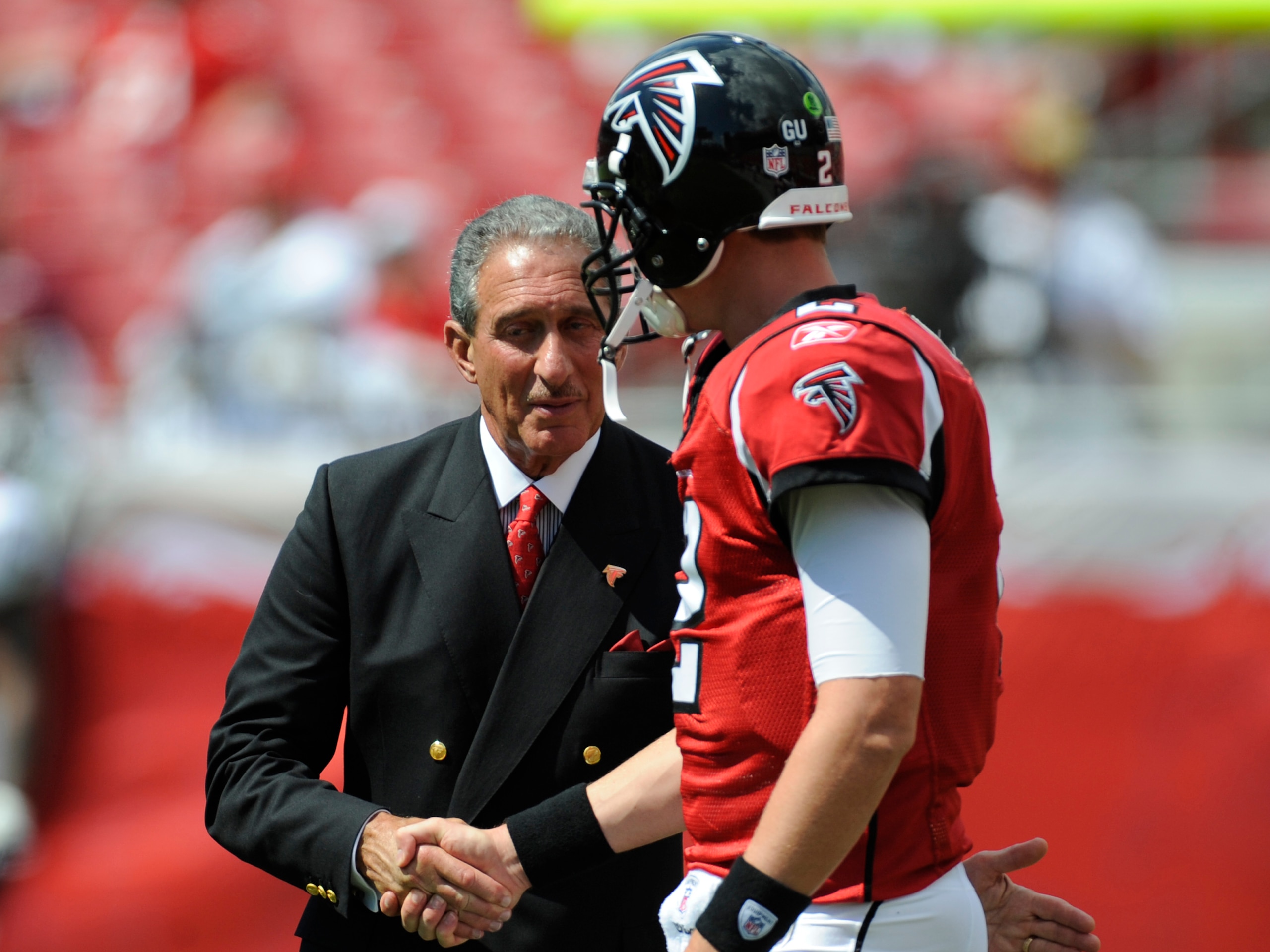 TAMPA, FL - SEPTEMBER 14: Owner Arthur Blank of the Atlanta Falcons greets quarterback Matt Ryan #2 before play against the Tampa Bay Buccaneers at Raymond James Stadium on September 14, 2008 in Tampa, Florida.  (Photo by Al Messerschmidt/Getty Images)