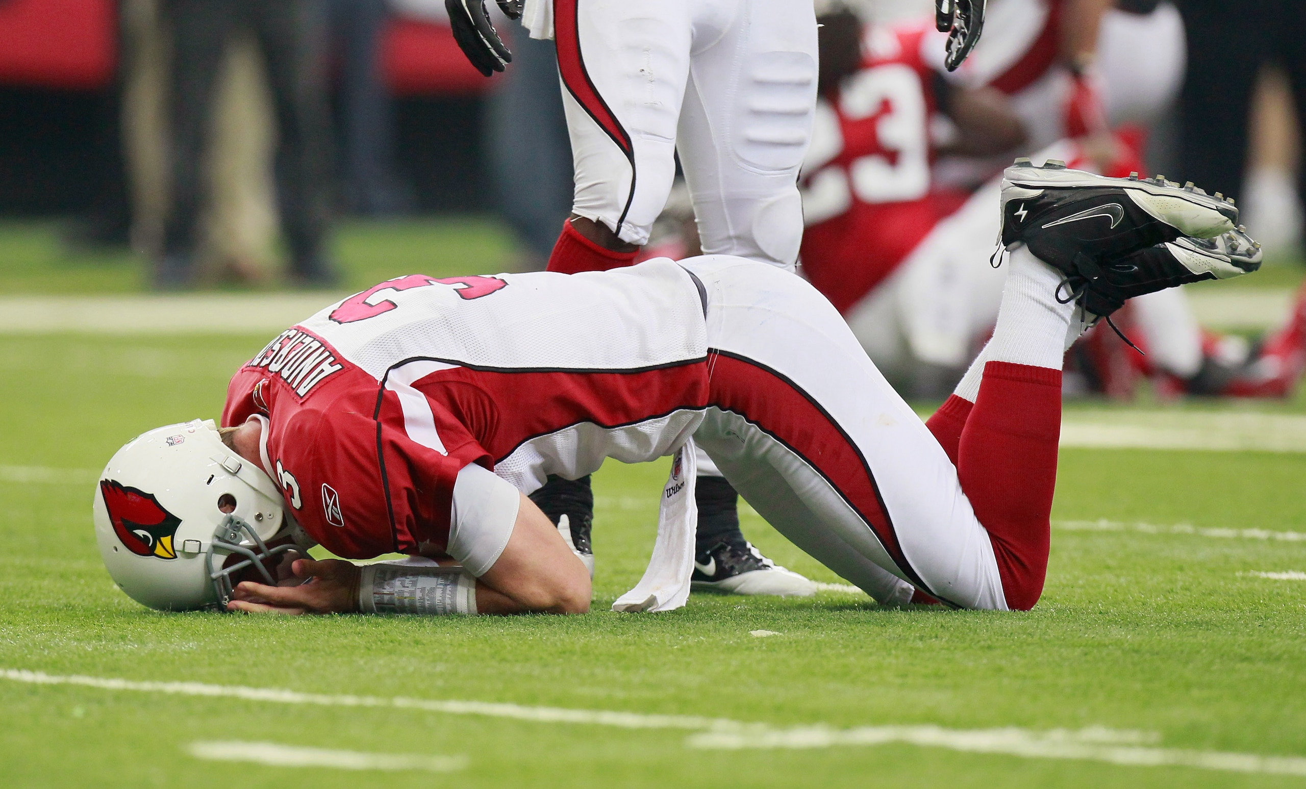 ATLANTA - SEPTEMBER 19:  Quarterback Derek Anderson #3 of the Arizona Cardinals lays on the field after getting hit by the Atlanta Falcons at Georgia Dome on September 19, 2010 in Atlanta, Georgia.  (Photo by Kevin C. Cox/Getty Images)