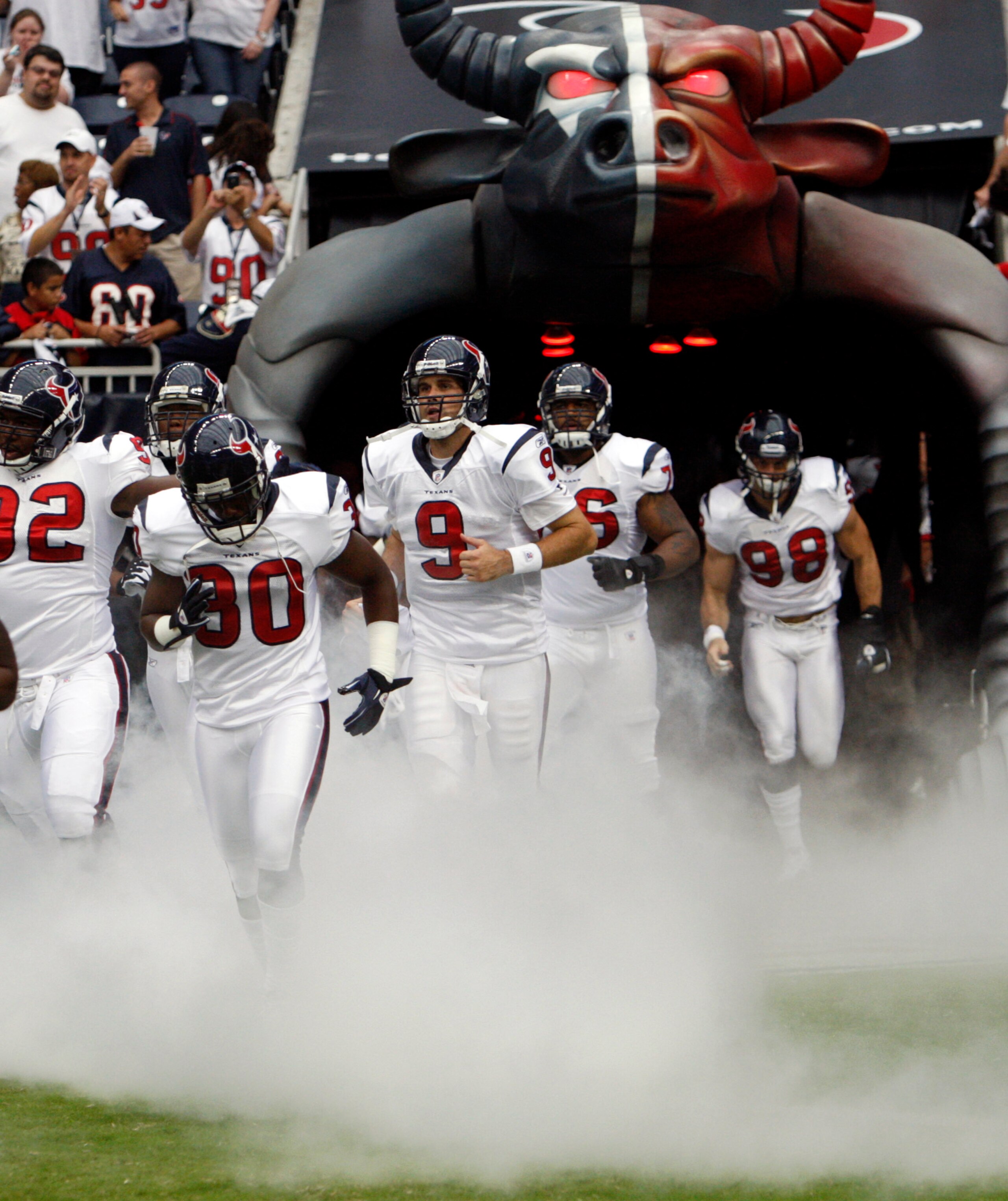 HOUSTON - SEPTEMBER 12:  Andre Johnson #80 and Matt Leinart #9 are introduced to the crowd before playing the Indianapolis Colt during the NFL season opener at Reliant Stadium on September 12, 2010 in Houston, Texas.  (Photo by Bob Levey/Getty Images)
