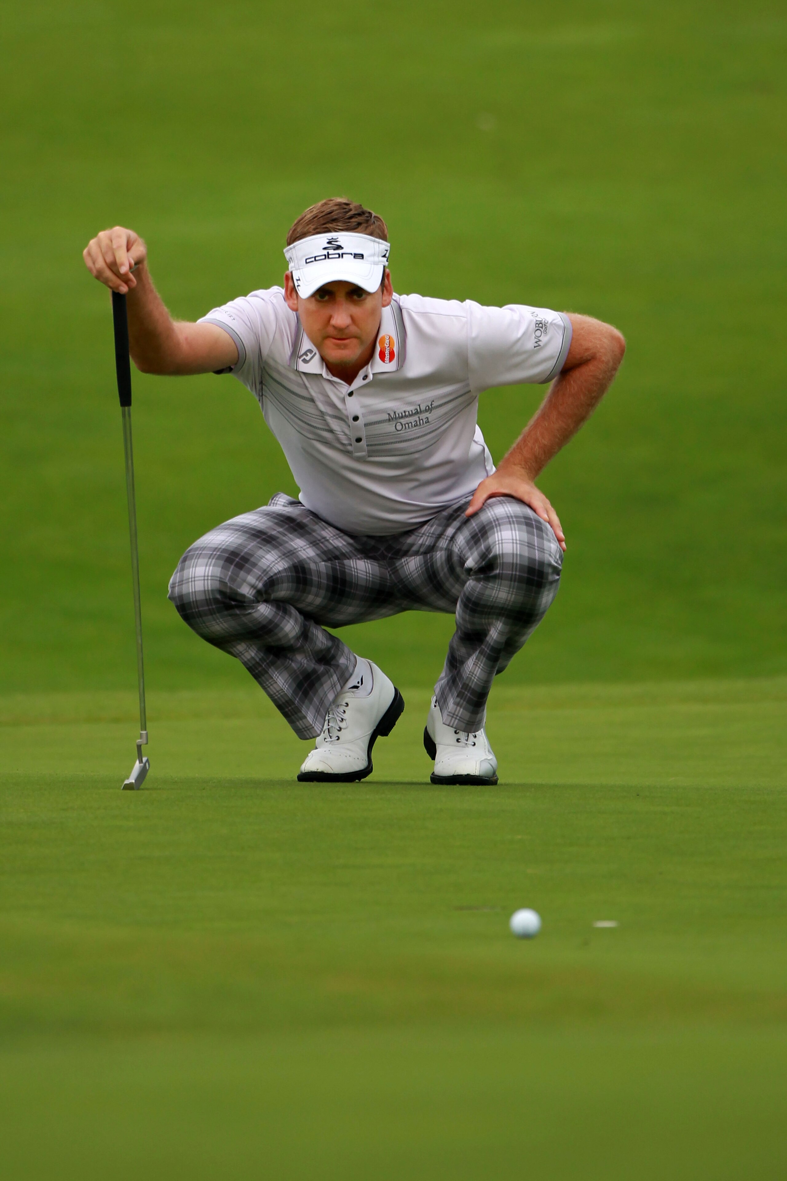 KOHLER, WI - AUGUST 14:  Ian Poulter of England lines up a putt during the continuation of the second round of the 92nd PGA Championship on the Straits Course at Whistling Straits on August 14, 2010 in Kohler, Wisconsin.  (Photo by Andrew Redington/Getty 