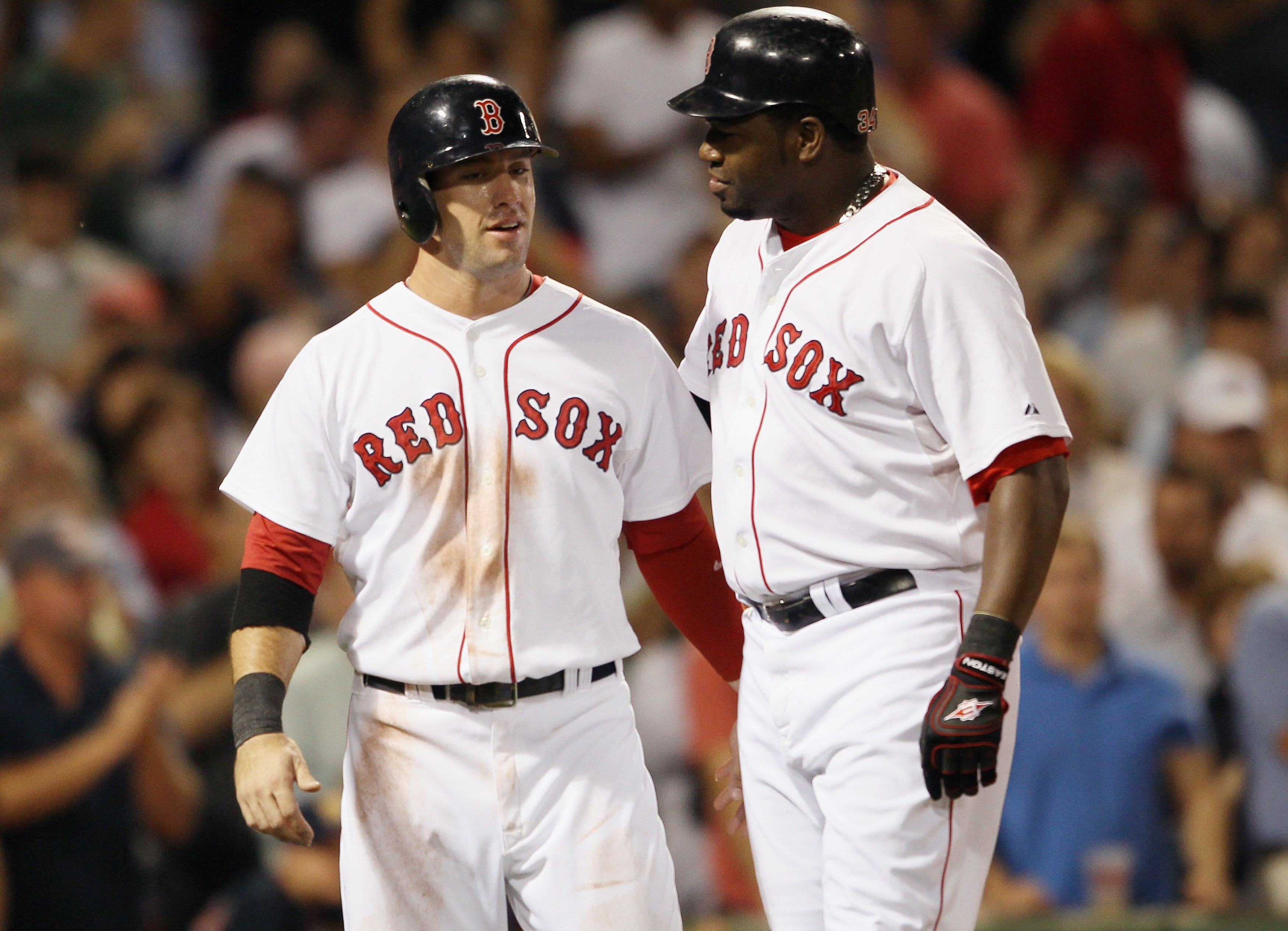 BOSTON - SEPTEMBER 22:  Ryan Kalish #55 of the Boston Red Sox congratulates teammate David Ortiz #34 after Ortiz hit a 3 RBI home run in the fourth inning against the Baltimore Orioles on September 22, 2010 at Fenway Park in Boston, Massachusetts.  (Photo