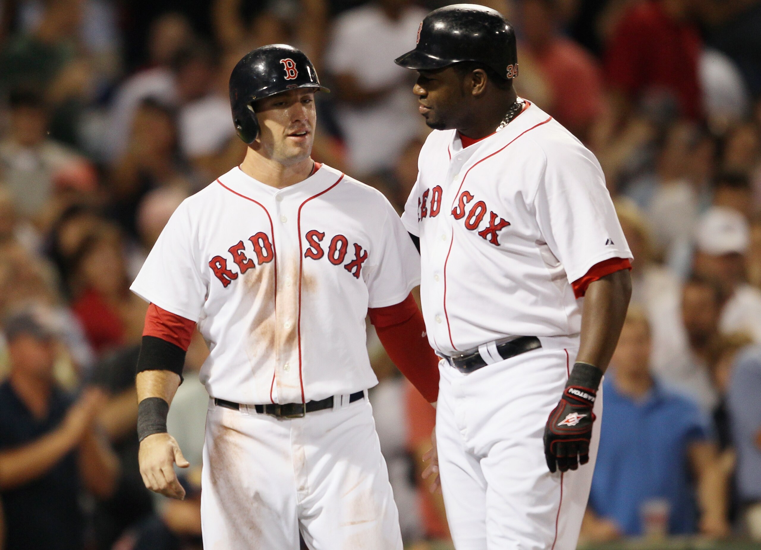 BOSTON - SEPTEMBER 22:  Ryan Kalish #55 of the Boston Red Sox congratulates teammate David Ortiz #34 after Ortiz hit a 3 RBI home run in the fourth inning against the Baltimore Orioles on September 22, 2010 at Fenway Park in Boston, Massachusetts.  (Photo
