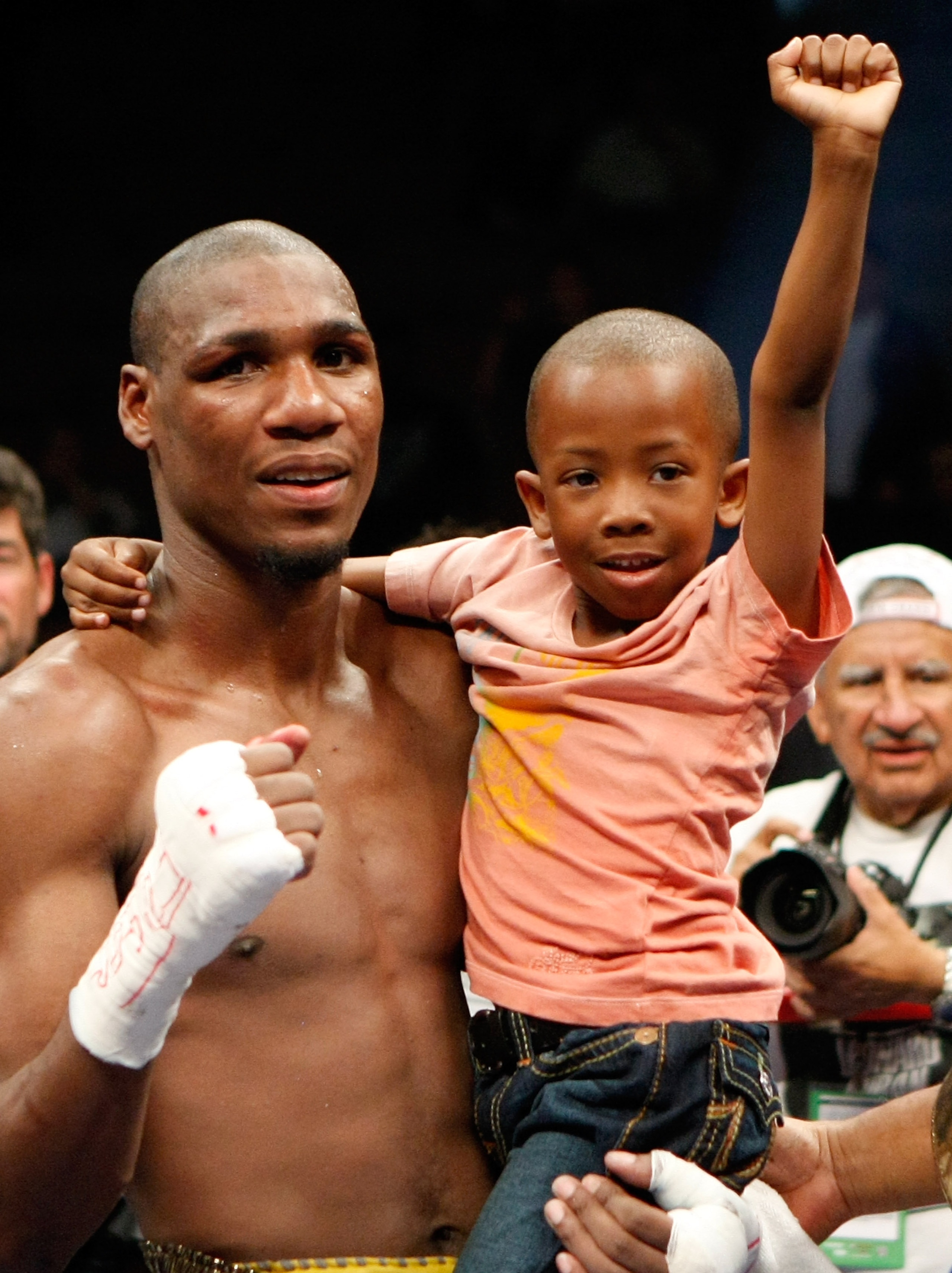 LAS VEGAS - APRIL 11:  Paul Williams holds his son Paul Williams Jr. as he celebrates defeating Winky Wright in a unanimous decision in their middleweight bout at the Mandalay Bay Events Center April 11, 2009 in Las Vegas, Nevada.  (Photo by Ethan Miller/