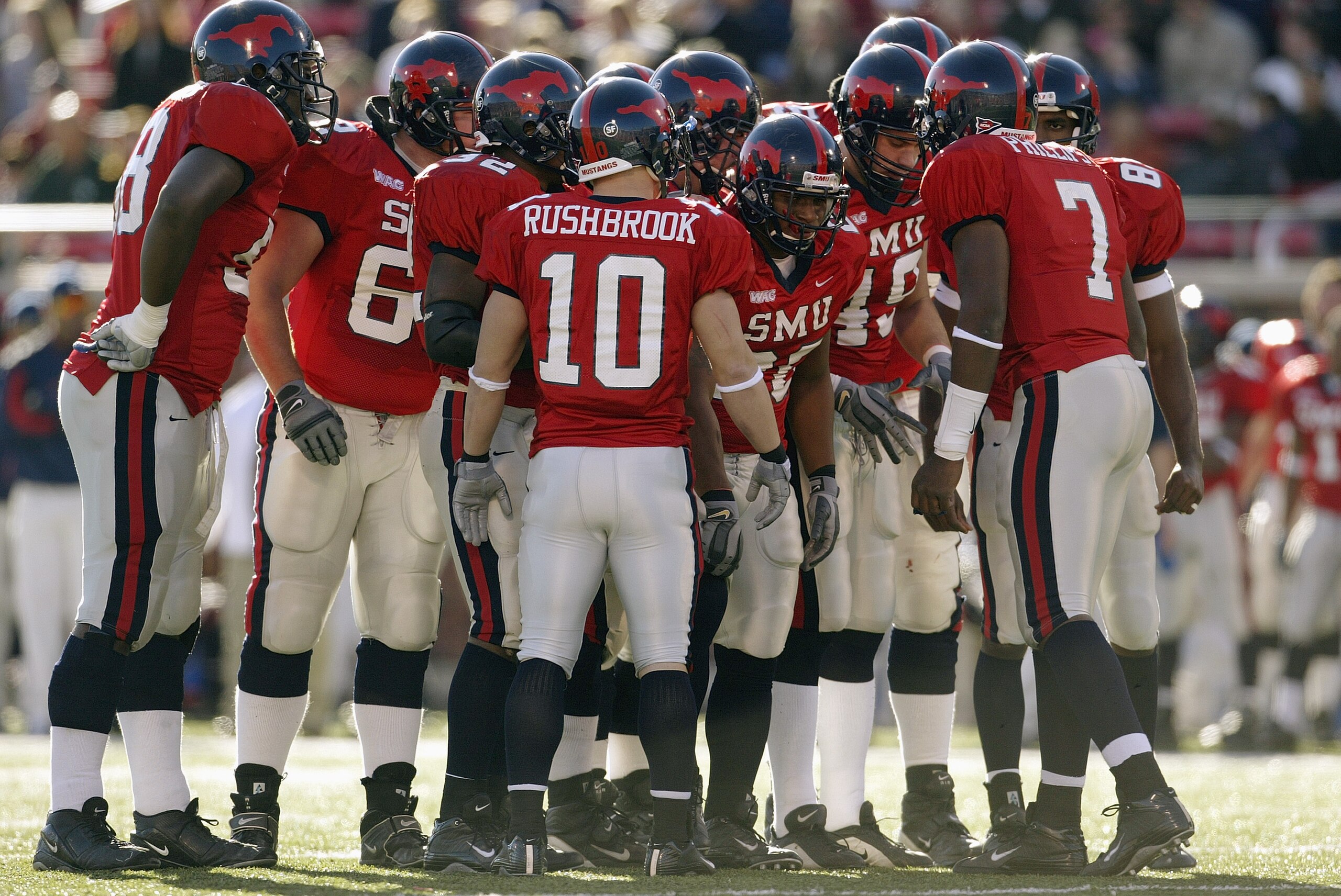 DALLAS - NOVEMBER 29: The Southern Methodist University Mustangs talk in the huddle during the game against the Texas Christian University Horned Frogs on November 29, 2003 at Gerald J. Ford Stadium in Dallas, Texas. TCU won 20-13. (Photo by Brian Bahr/ DALLAS - NOVEMBER 29: The Southern Methodist University Mustangs talk in the huddle during the game against the Texas Christian University Horned Frogs on November 29, 2003 at Gerald J. Ford Stadium in Dallas, Texas. TCU won 20-13. (Photo by Brian Bahr/