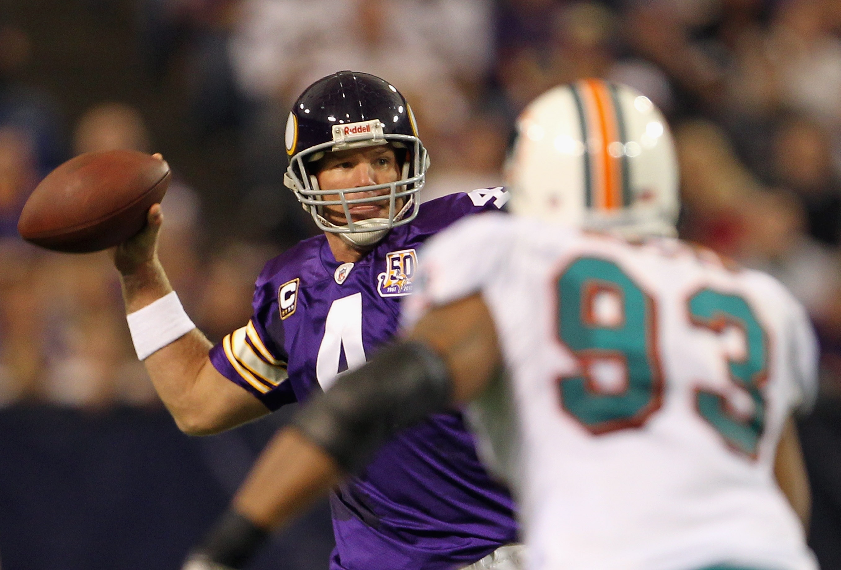 MINNEAPOLIS - SEPTEMBER 19:  Quarterback Brett Favre #4 of the Minnesota Vikings drops back to pass as Quentin Moses #93 of the Miami Dolphins defends during the game on September 19, 2010 at Hubert H. Humphrey Metrodome in Minneapolis, Minnesota.  (Photo