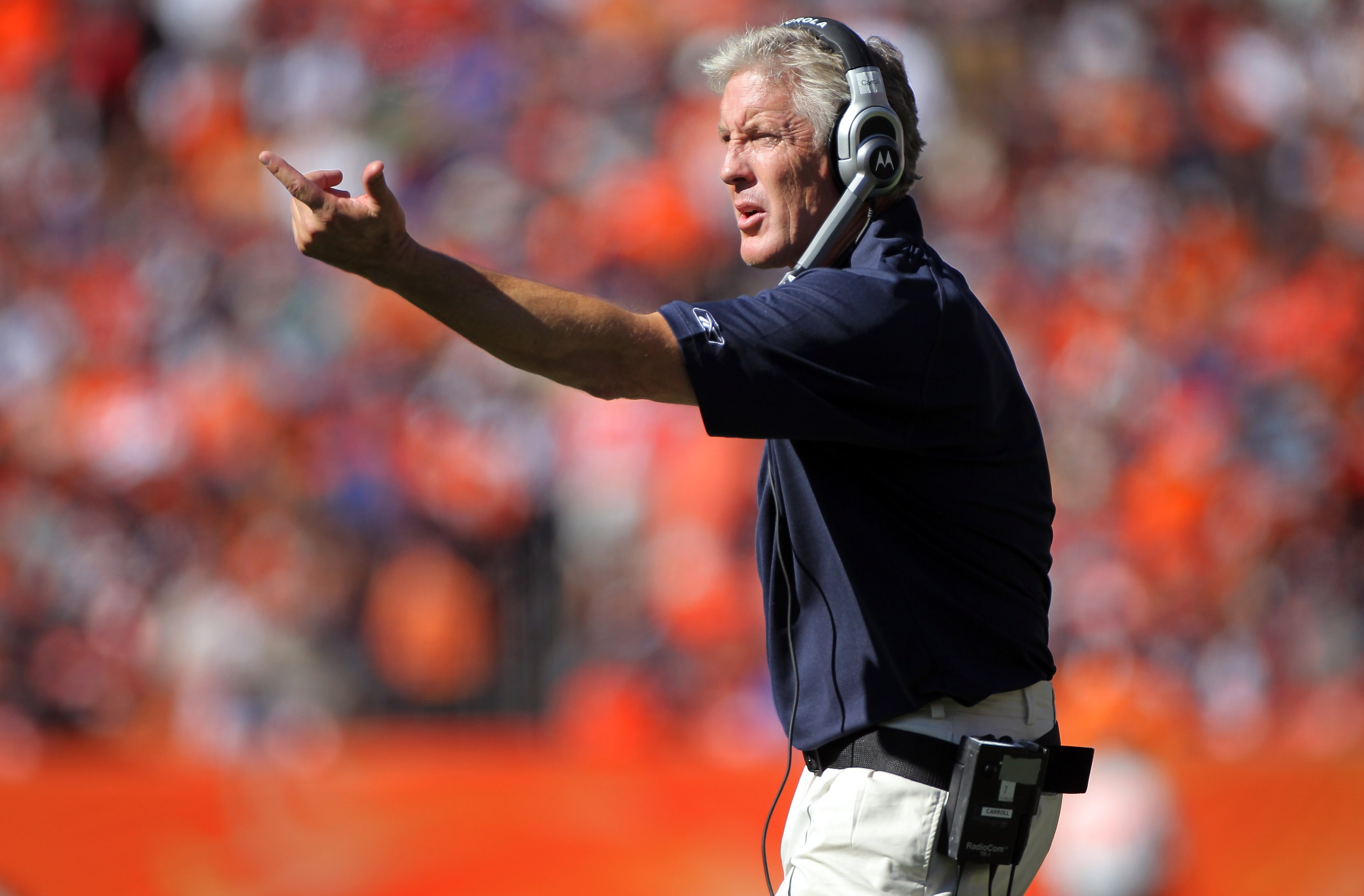 DENVER - SEPTEMBER 19:  Head coach Pete Carroll of the Seattle Seahawks directs his team against the Denver Broncos at INVESCO Field at Mile High on September 19, 2010 in Denver, Colorado. The Broncos defeated the Seahawks 31-14.  (Photo by Doug Pensinger