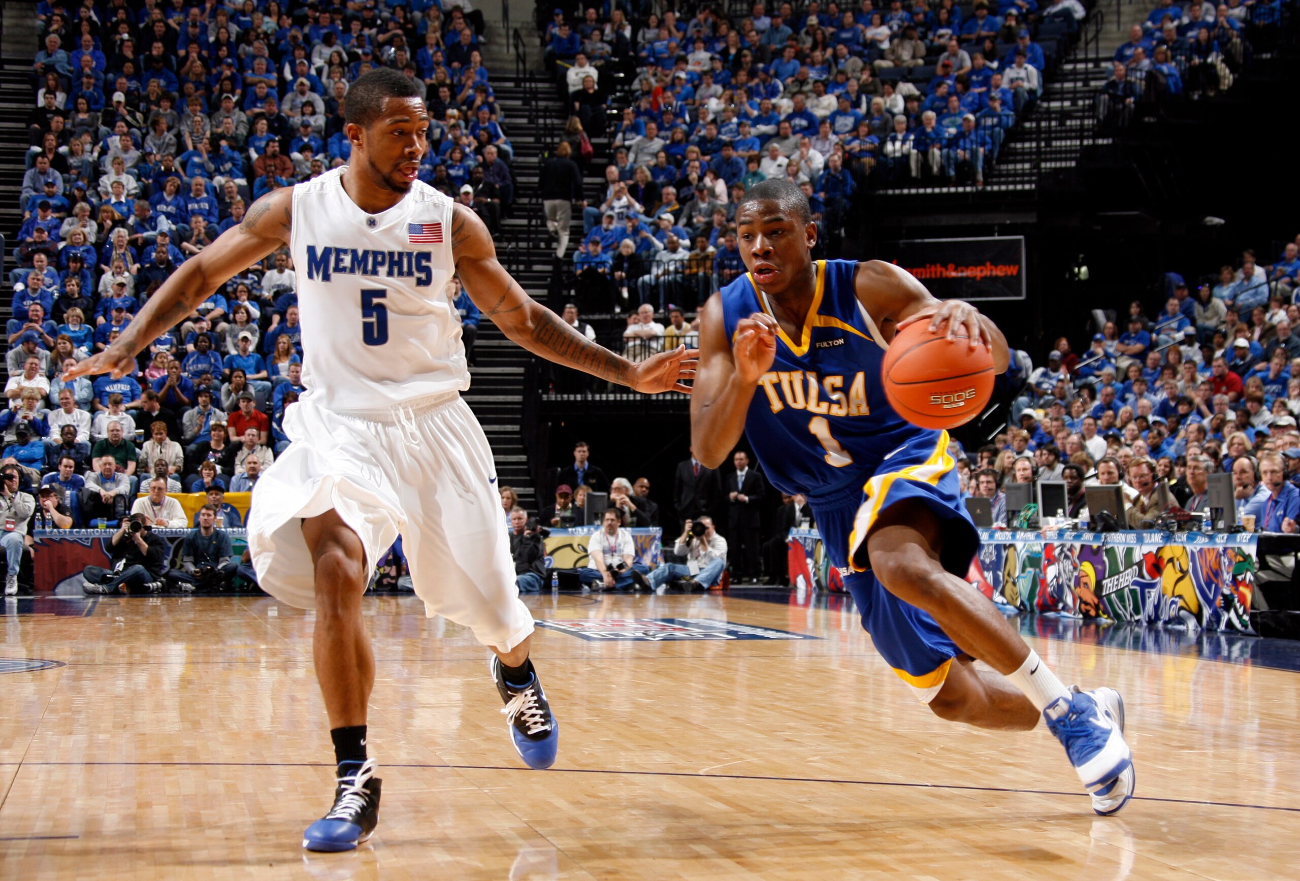 MEMPHIS, TN - MARCH 15: Ben Uzoh #1 of the Tulsa Golden Hurricane shoots a jumpshot over Andre Allen #15 of the Memphis Tigers during the finals of the Conference USA Basketball Tournament at FedExForum on March 15, 2008 in Memphis, Tennessee. Memphis bea