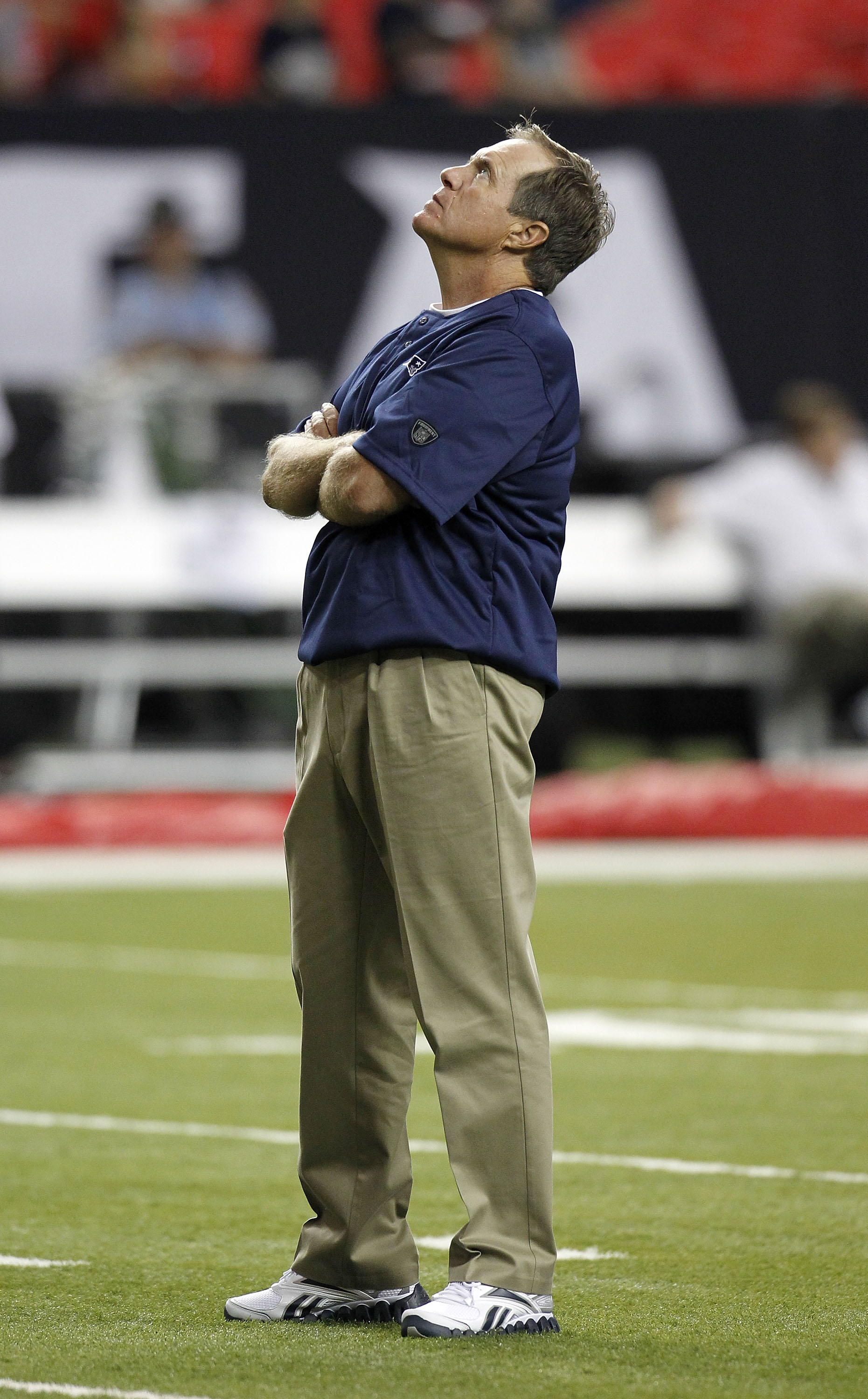 ATLANTA - AUGUST 19:  Head coach Bill Belichick of the New England Patriots watches a punt during pre-game drills before the preseason game against the Atlanta Falcons at the Georgia Dome on August 19, 2010 in Atlanta, Georgia.  (Photo by Mike Zarrilli/Ge