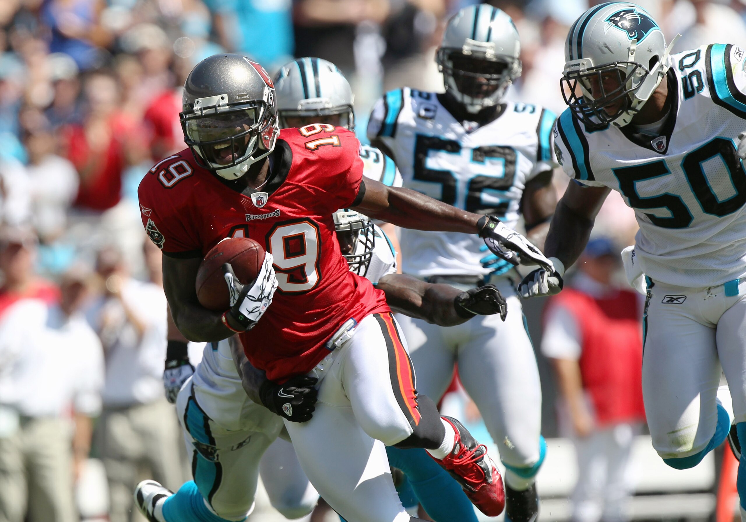 CHARLOTTE, NC - SEPTEMBER 19: Mike Williams #19 of the Tampa Bay Buccaneers breaks a tackle on his way to scoring a touchdown against the Carolina Panthers during their game at Bank of America Stadium on September 19, 2010 in Charlotte, North Carolina. CHARLOTTE, NC - SEPTEMBER 19: Mike Williams #19 of the Tampa Bay Buccaneers breaks a tackle on his way to scoring a touchdown against the Carolina Panthers during their game at Bank of America Stadium on September 19, 2010 in Charlotte, North Carolina.