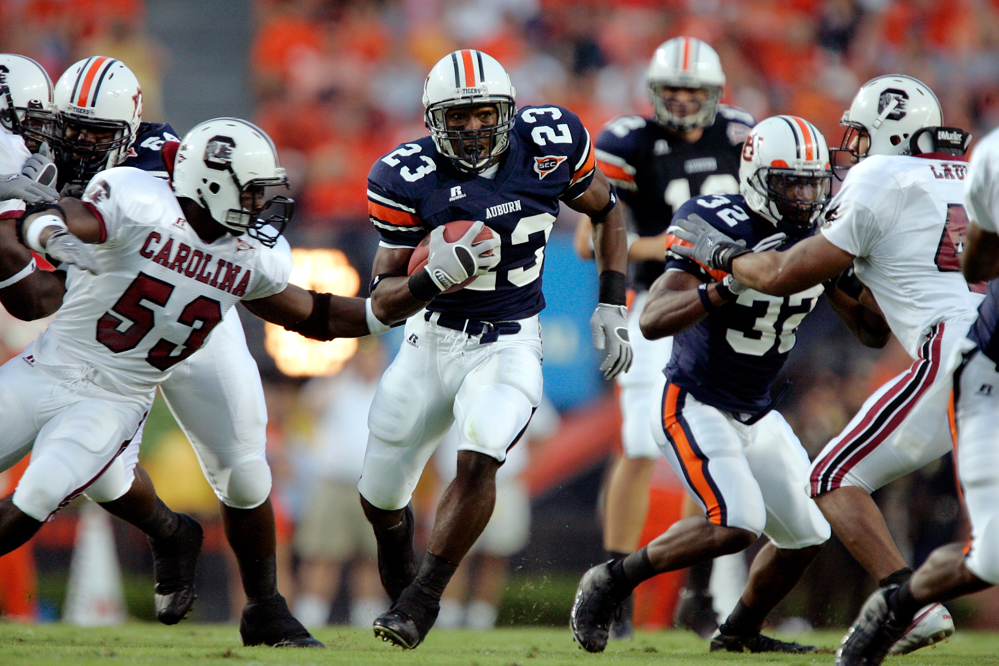 AUBURN, AL - OCTOBER 1:  Running back Kenny Irons #23 of the Auburn Tigers breaks through the South Carolina Gamecocks defense in the first quarter on October 1, 2005 at Jordan-Hare Stadium in Auburn, Alabama.  (Photo by Brian Bahr/Getty Images)