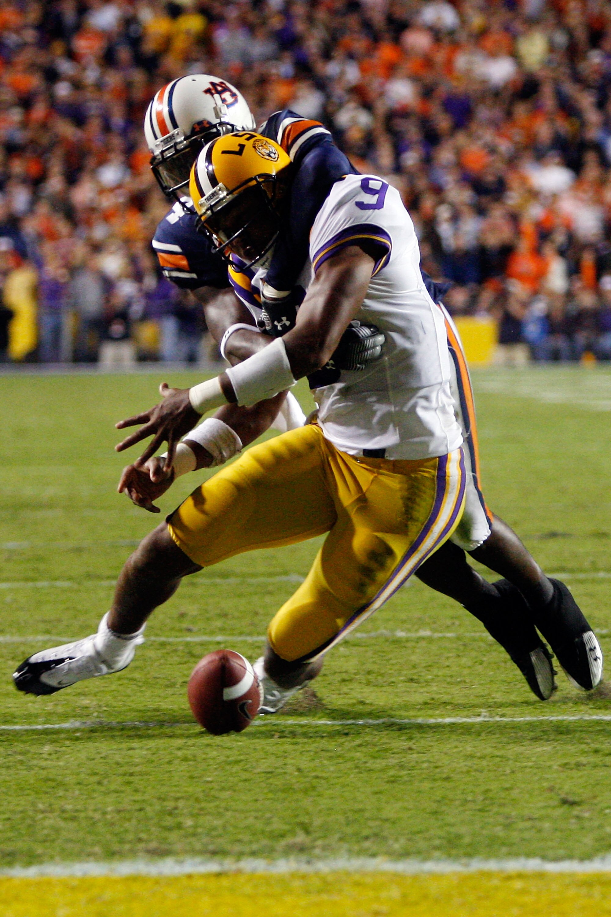 BATON ROUGE, LA - OCTOBER 24:  Jordan Jefferson #9 of the Louisiana State University Tigers is stripped of the ball by Zac Etheridge #4 of the Auburn Tigers at Tiger Stadium on October 24, 2009 in Baton Rouge, Louisiana.  (Photo by Chris Graythen/Getty Im