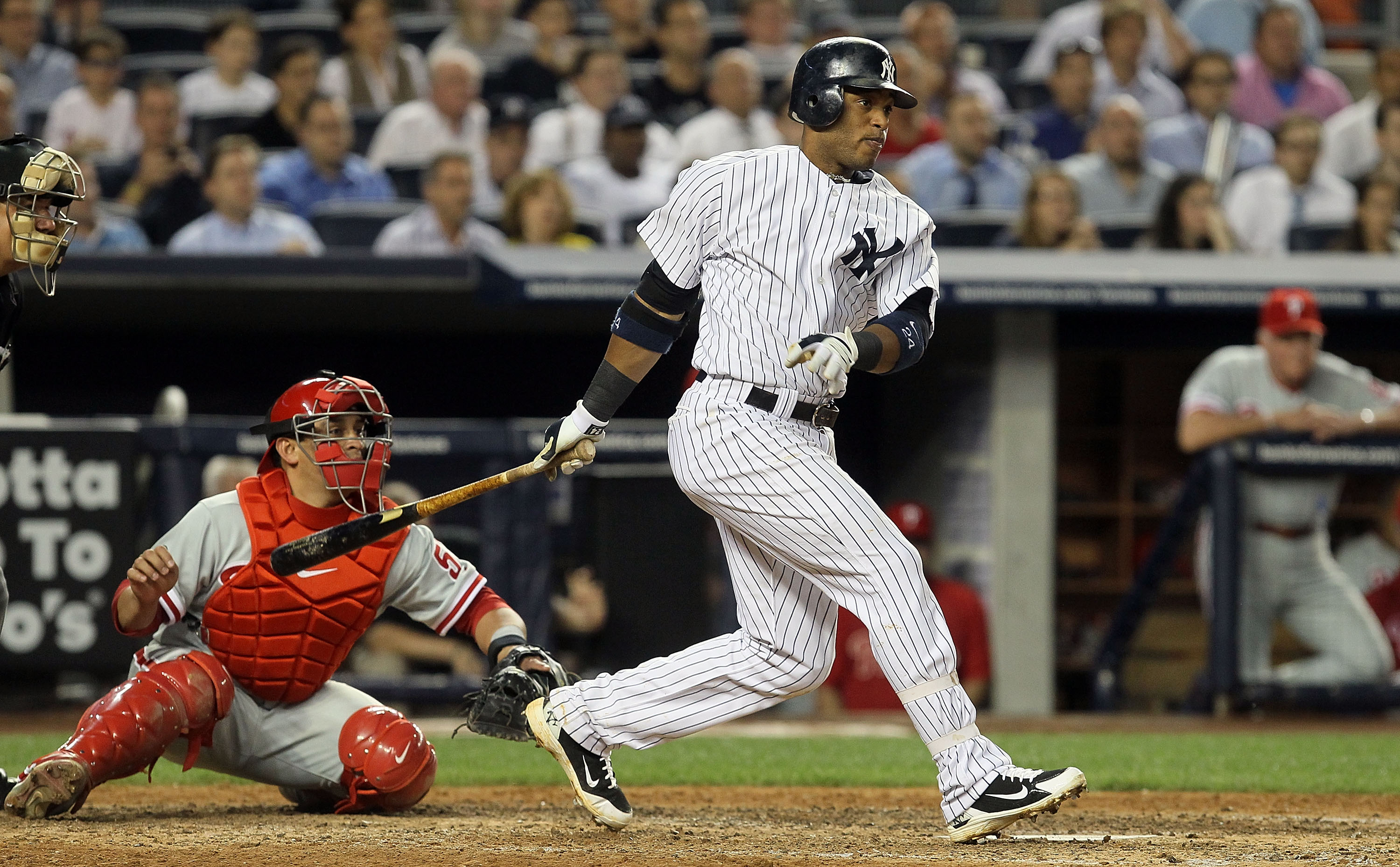 NEW YORK - JUNE 17:  Robinson Cano #24 of the New York Yankees connects on a sixth inning RBI single in the sixth inning against the Philadelphia Phillies on June 17, 2010 at Yankee Stadium in the Bronx borough of New York City.  (Photo by Jim McIsaac/Get