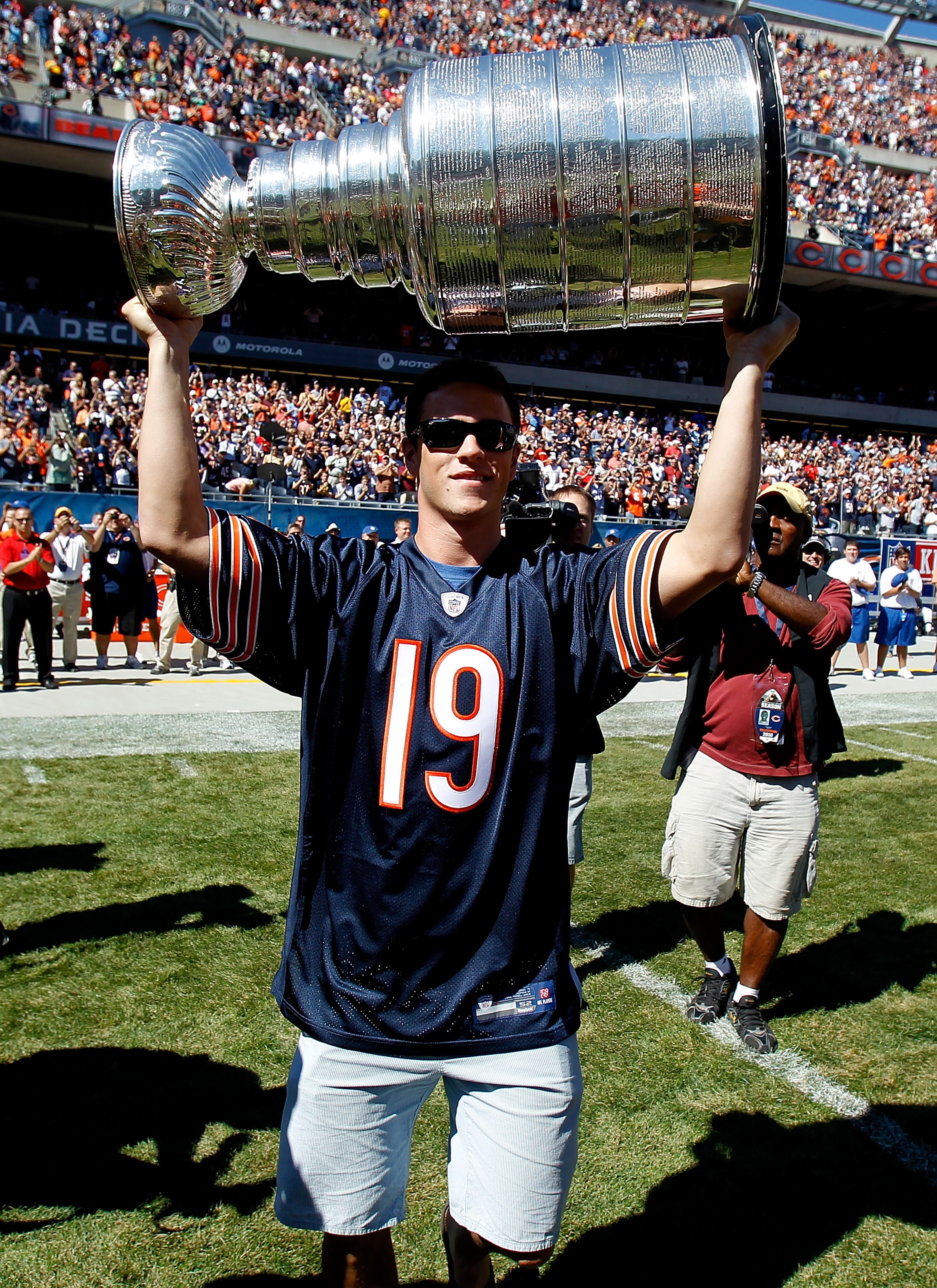 CHICAGO - SEPTEMBER 12: Jonathan Toews of the Chicago Blackhawks carries the Stanley Cup to the field before the NFL opening season game between the Chicago Bears and the Detroit Lions at Soldier Field on September 12, 2010 in Chicago, Illinois. The Bea CHICAGO - SEPTEMBER 12: Jonathan Toews of the Chicago Blackhawks carries the Stanley Cup to the field before the NFL opening season game between the Chicago Bears and the Detroit Lions at Soldier Field on September 12, 2010 in Chicago, Illinois. The Bea