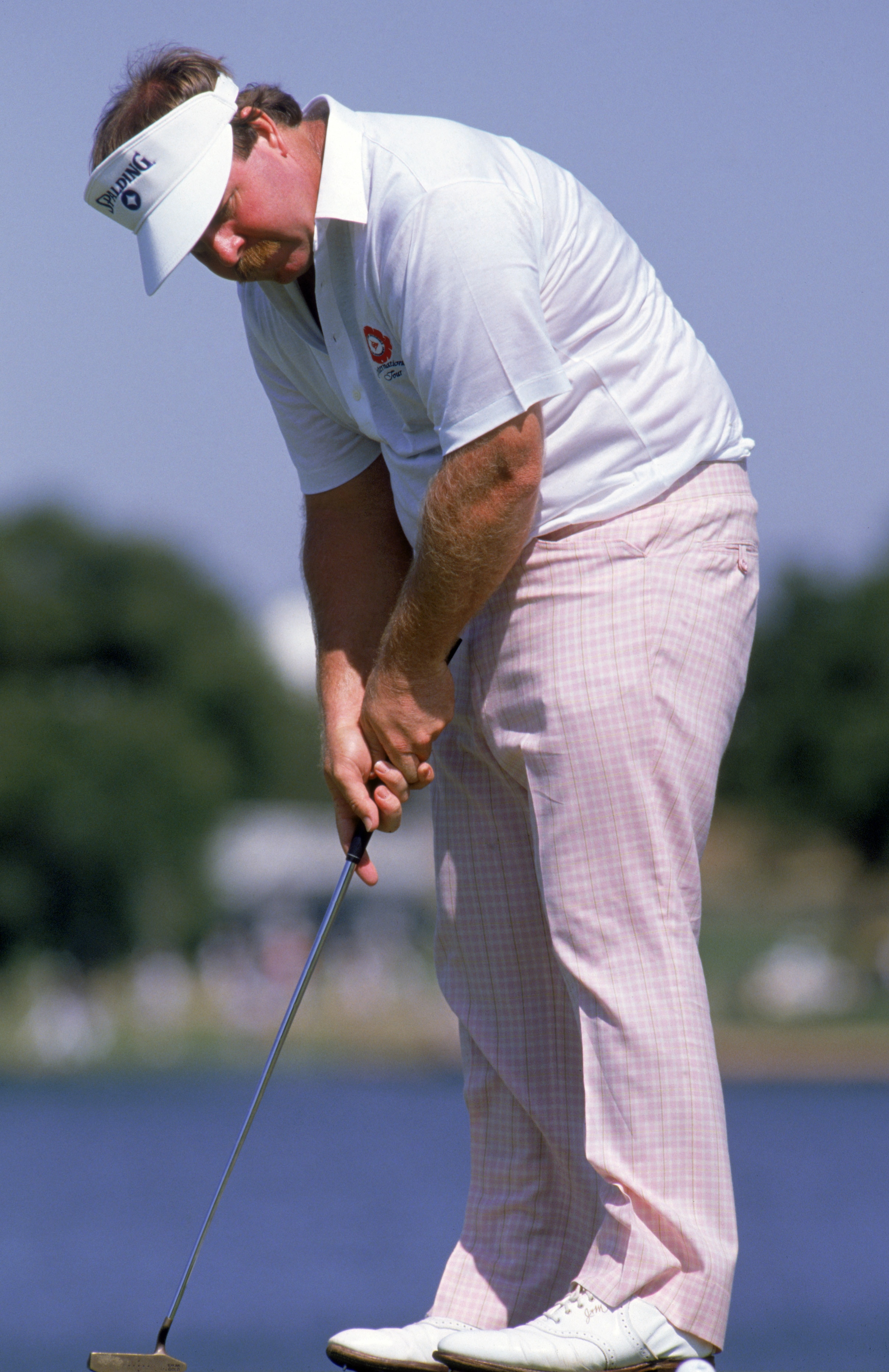 1988:  Craig Stadler putts the ball during a 1988 PGA game.  (Mike Powell/Getty Images)