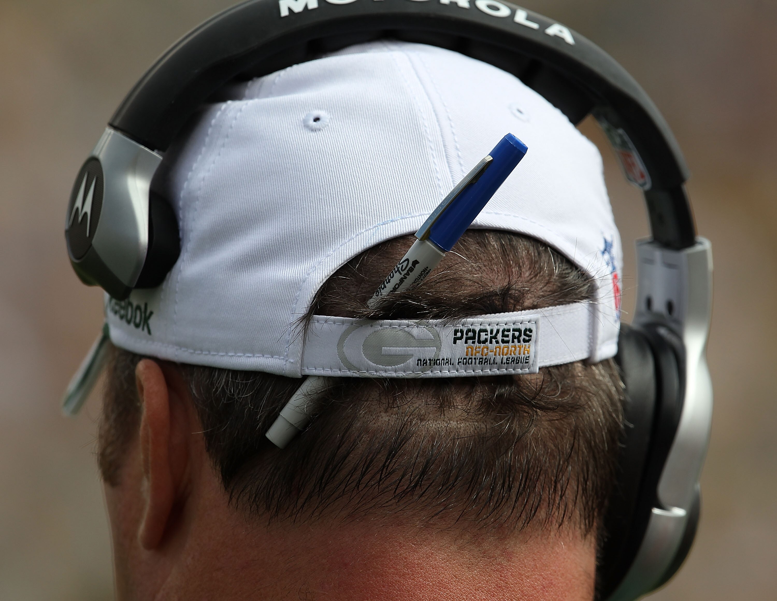 GREEN BAY, WI - SEPTEMBER 19: Head coach Mike McCarthy of the Green Bay Packers sports a pen in the back of his hat as his team takes on the Buffalo Bills at Lambeau Field on September 19, 2010 in Green Bay, Wisconsin. The Packers defeated the Bills 34-7.