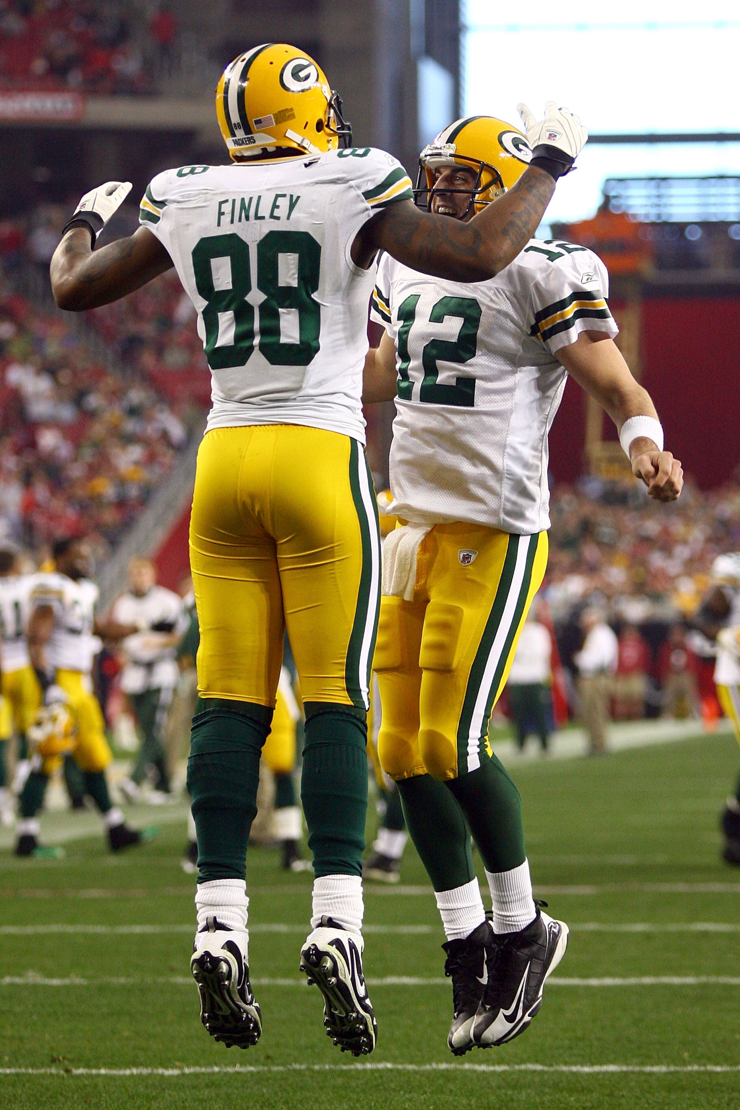GLENDALE, AZ - JANUARY 03: Jermichael Finley #88 of the Green Bay Packers and quarterback Aaron Rodgers #12 celebrate after Finley catches a five-yard touchdown against the Arizona Cardinals in the third quarter at University of Phoenix Stadium on Januar GLENDALE, AZ - JANUARY 03: Jermichael Finley #88 of the Green Bay Packers and quarterback Aaron Rodgers #12 celebrate after Finley catches a five-yard touchdown against the Arizona Cardinals in the third quarter at University of Phoenix Stadium on Januar