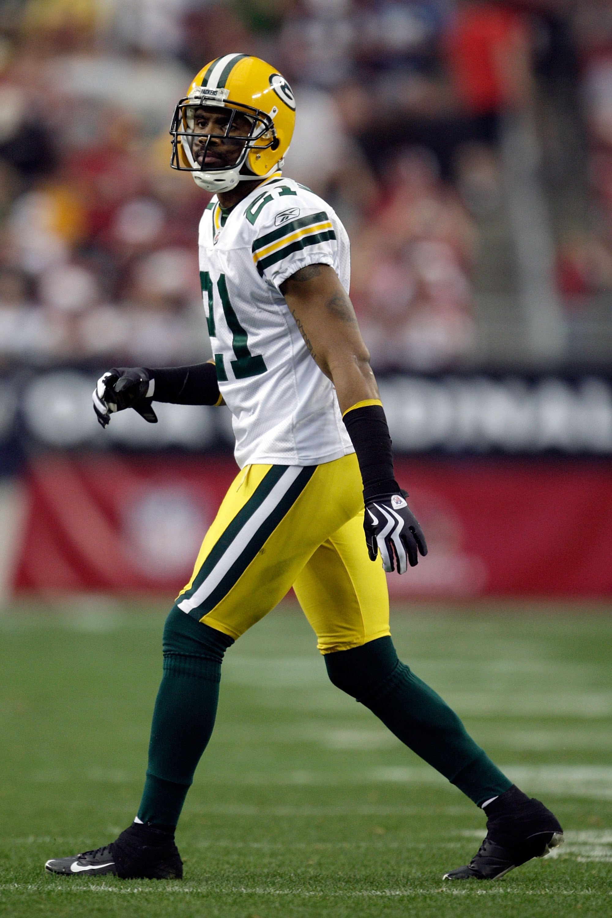GLENDALE, AZ - JANUARY 03:  Charles Woodson #21 of the Green Bay Packers looks on from the field against the Arizona Cardinals in the second quarter at University of Phoenix Stadium on January 3, 2010 in Glendale, Arizona.  (Photo by Jamie Squire/Getty Im