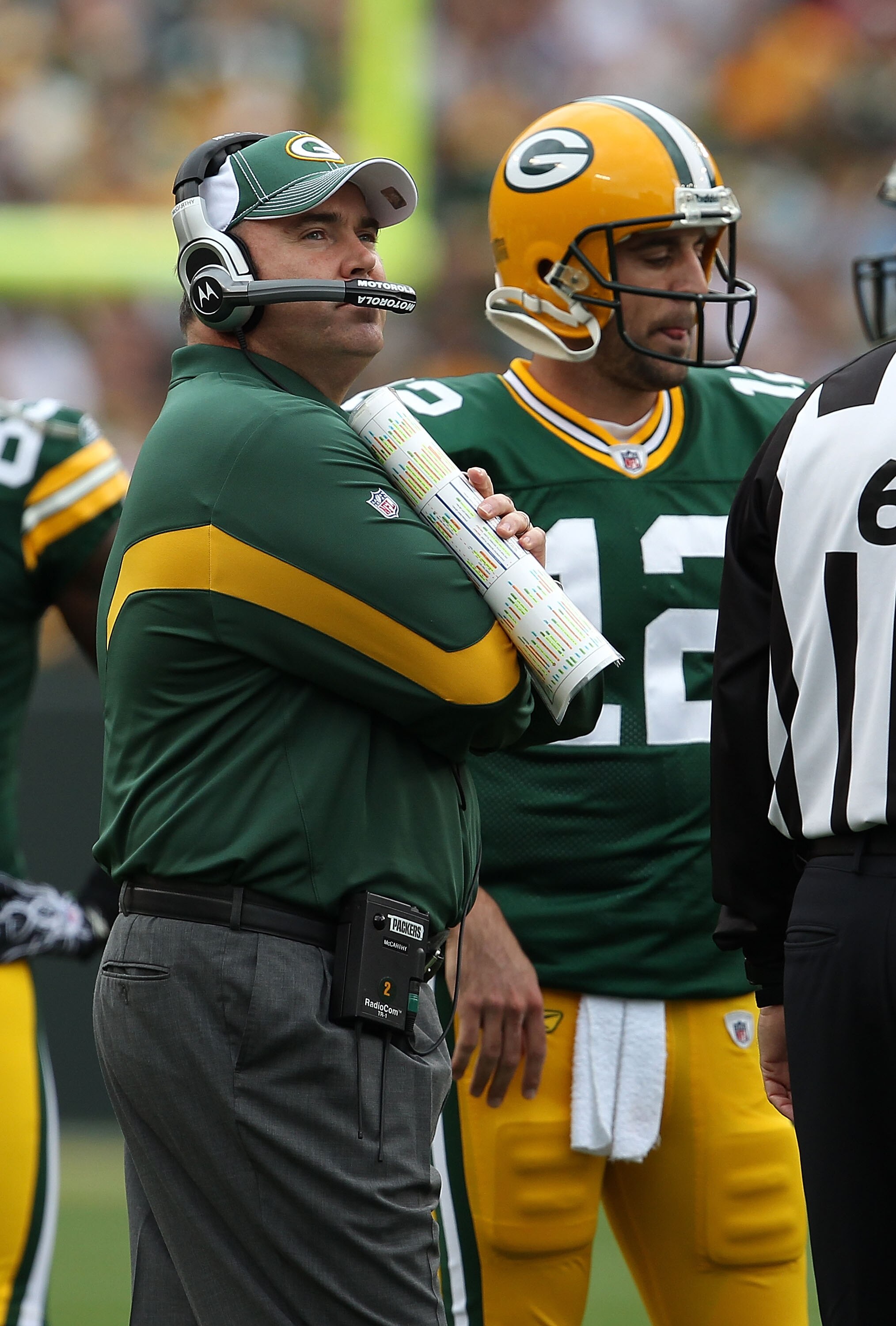 GREEN BAY, WI - SEPTEMBER 19: Head coach Mike McCarthy and Aaron Rodgers #12 of the Green Bay Packers wait for a replay challenge against the Buffalo Bills at Lambeau Field on September 19, 2010 in Green Bay, Wisconsin. The Packers defeated the Bills 34-7