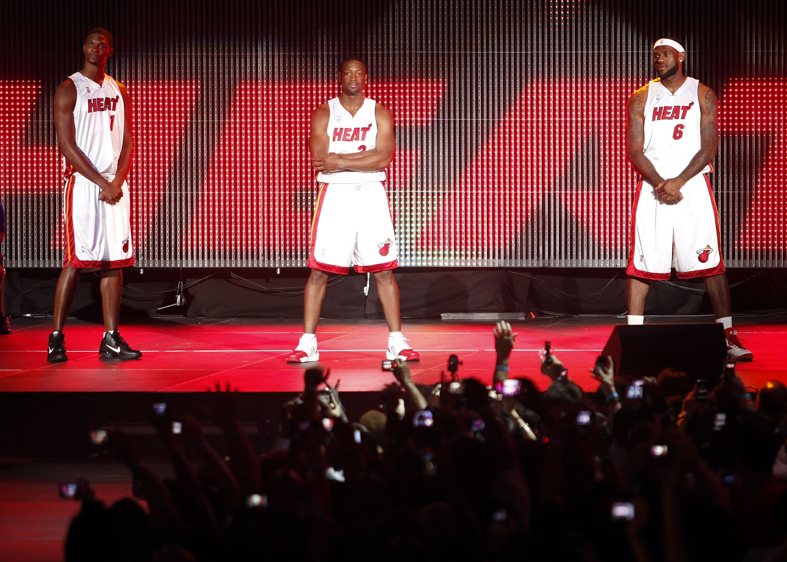 MIAMI - JULY 09:  Fans cheer as (L-R) Chris Bosh #1, Dwyane Wade #3, and LeBron James #6 of the Miami Heat are introduced during a welcome party at American Airlines Arena on July 9, 2010 in Miami, Florida.  (Photo by Marc Serota/Getty Images)