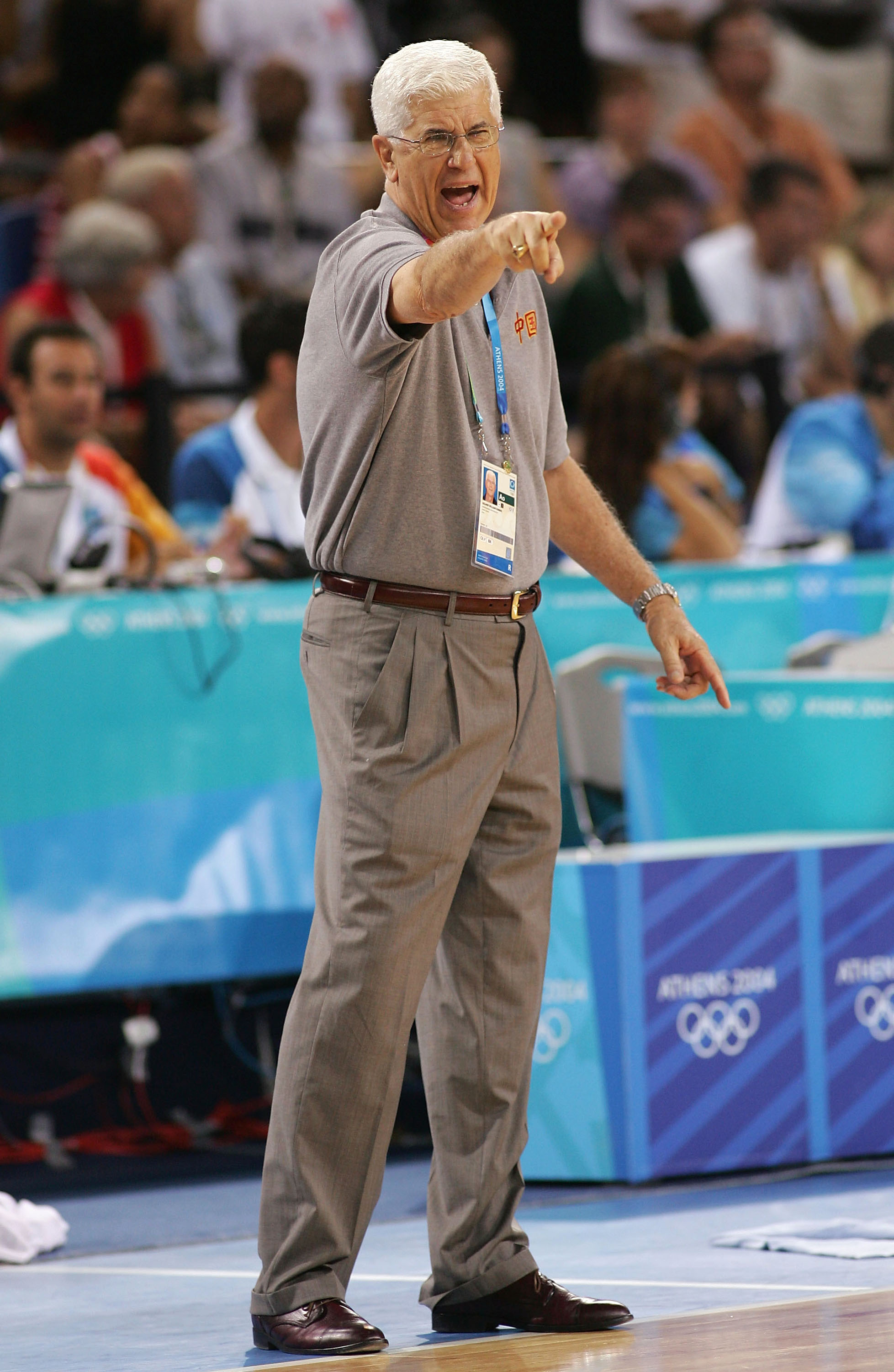 ATHENS - AUGUST 17:  Head Coach of China Del Harris shouts out orders to his players during the men's basketball preliminary game on August 17, 2004 during the Athens 2004 Summer Olympic Games at the Indoor Arena of the Helliniko Olympic Complex in Athens