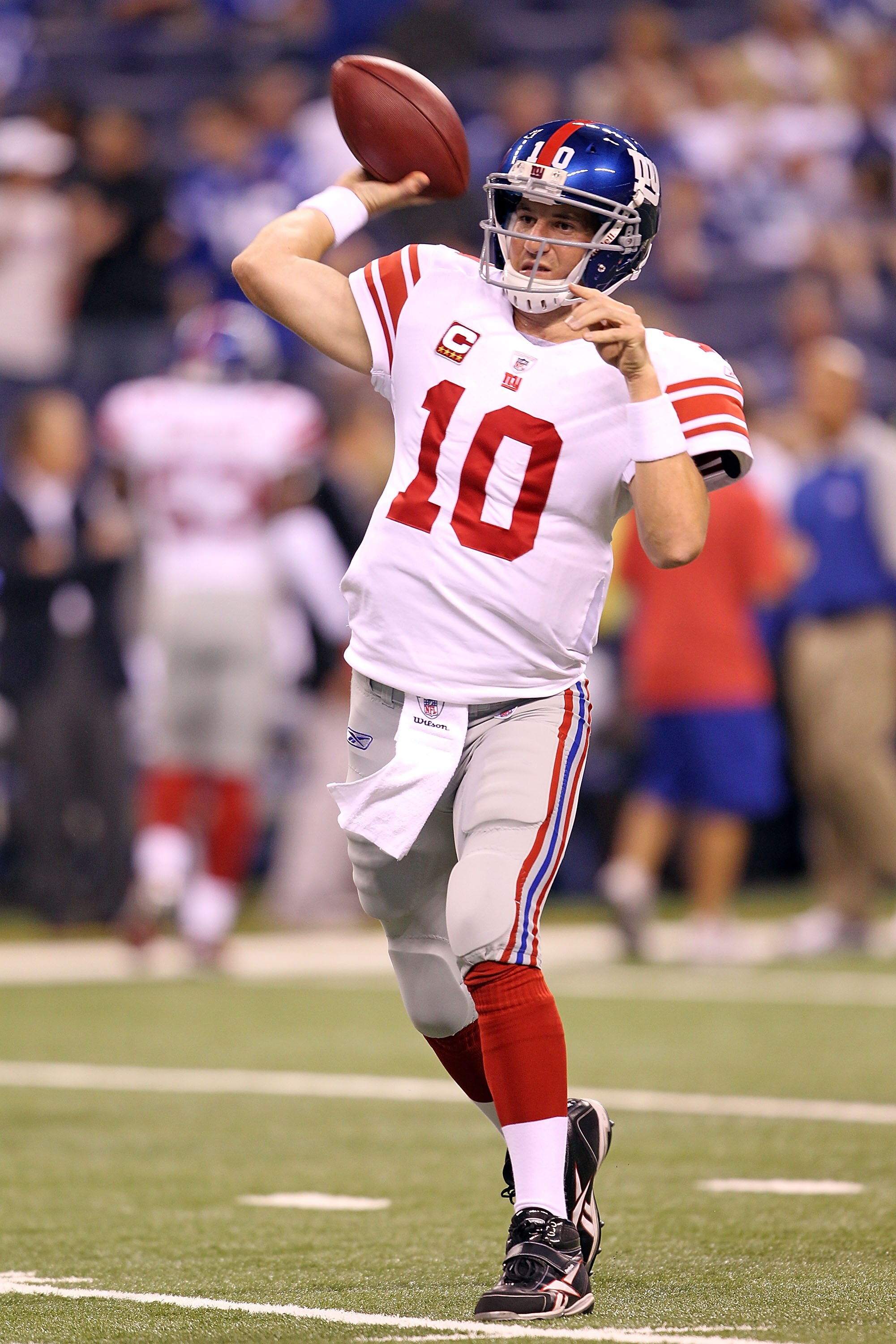 INDIANAPOLIS - SEPTEMBER 19:  Eli Manning #10  of the New York Giants throws a pass during  warmups before the NFL game against the Indianapolis Colts at Lucas Oil Stadium on September 19, 2010 in Indianapolis, Indiana.  (Photo by Andy Lyons/Getty Images)