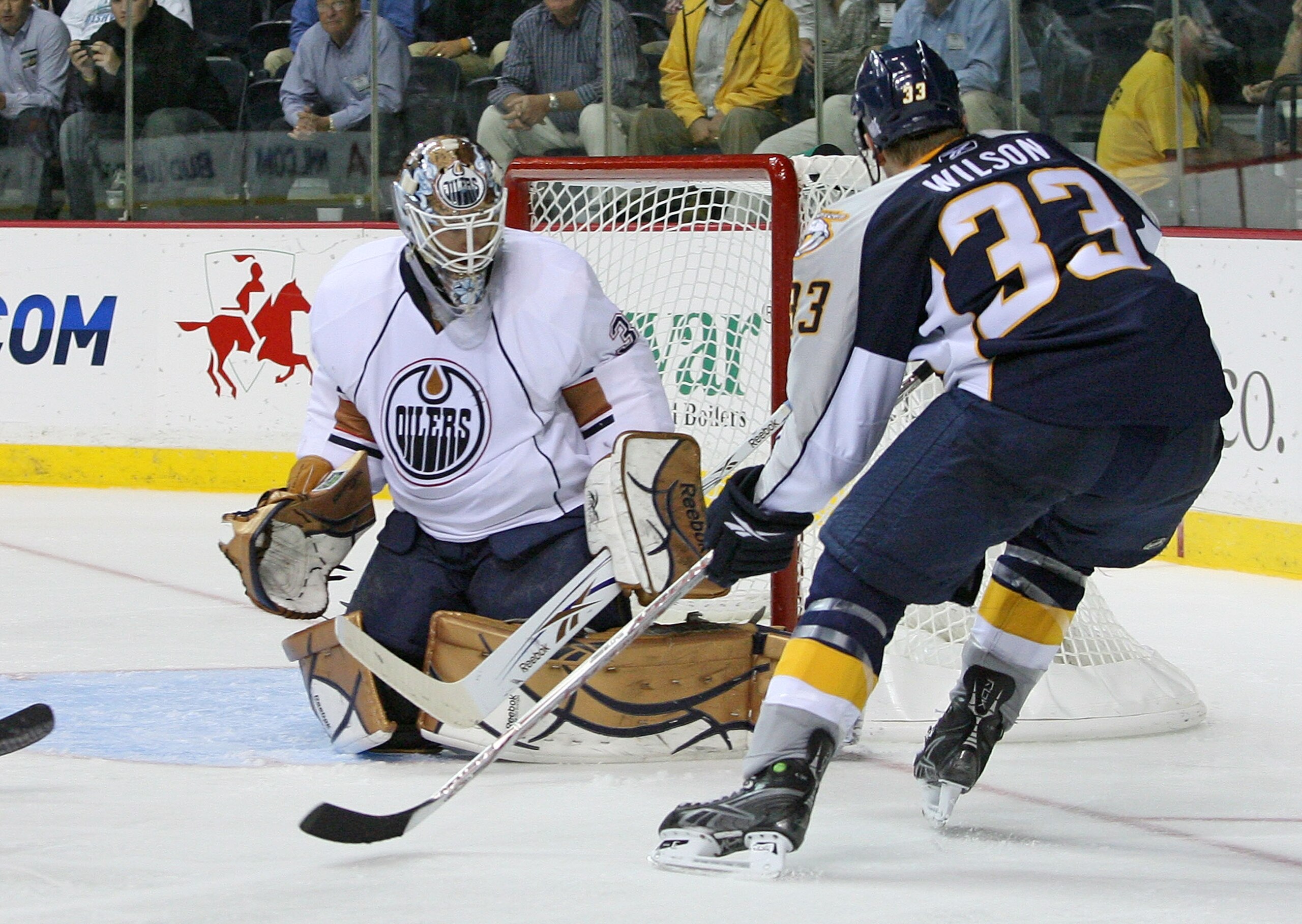 NASHVILLE, TN - OCTOBER 12:  Center Colin Wilson #33 of the Nashville Predators, appearing in his first career NHL game, looks for a rebound against goalie Jeff Deslauriers #38 of the Edmonton Oilers on October 12, 2009 at the Sommet Center in Nashville, 