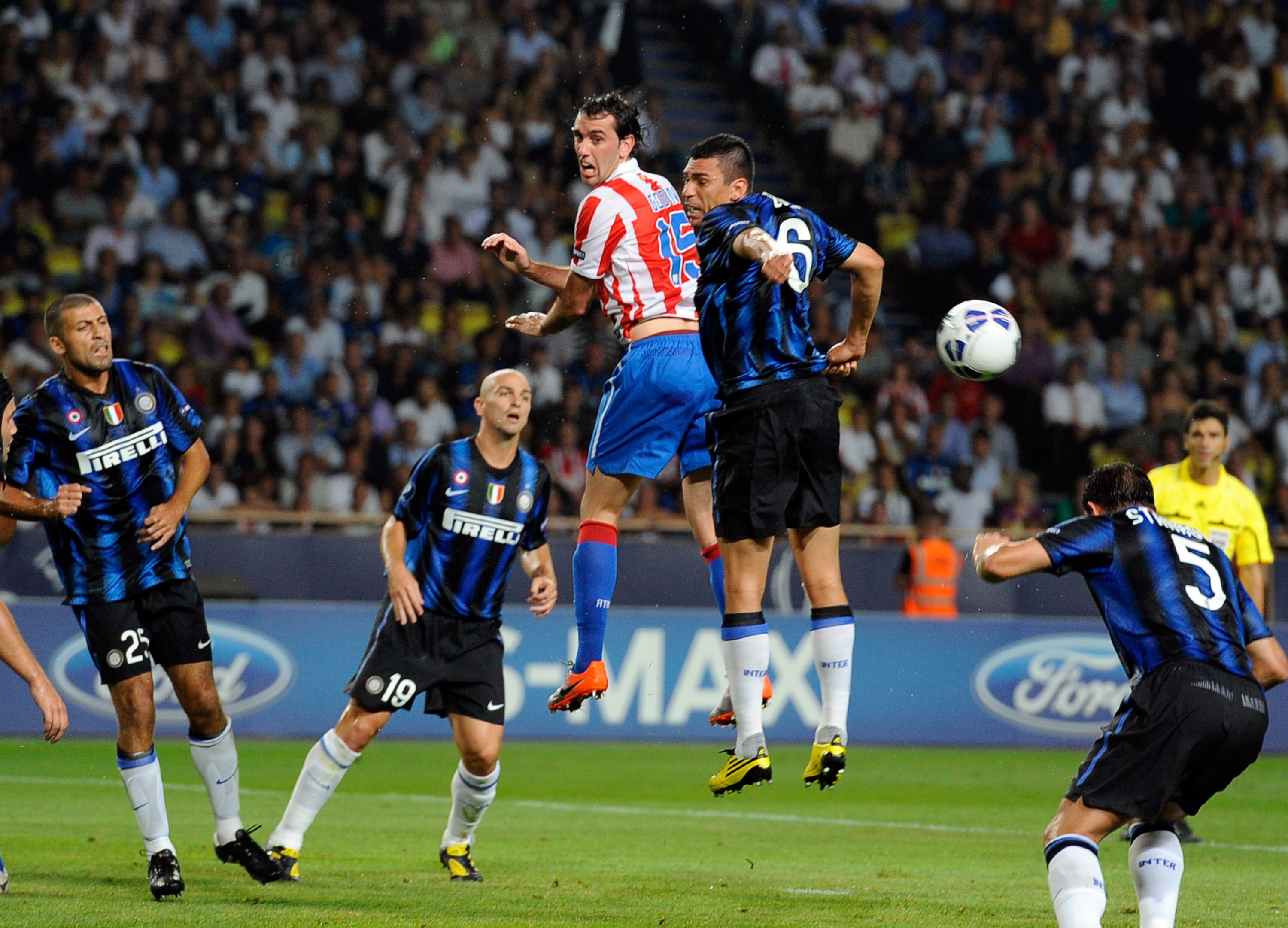 MONACO - AUGUST 27:  Lucio of Inter Milan and Diego Godin of Atletico Madrid competes for the ball during the UEFA Super Cup between Inter and Atletico Madrid at Louis II Stadium on August 27, 2010 in Monaco, Monaco.  (Photo by Claudio Villa/Getty Images)