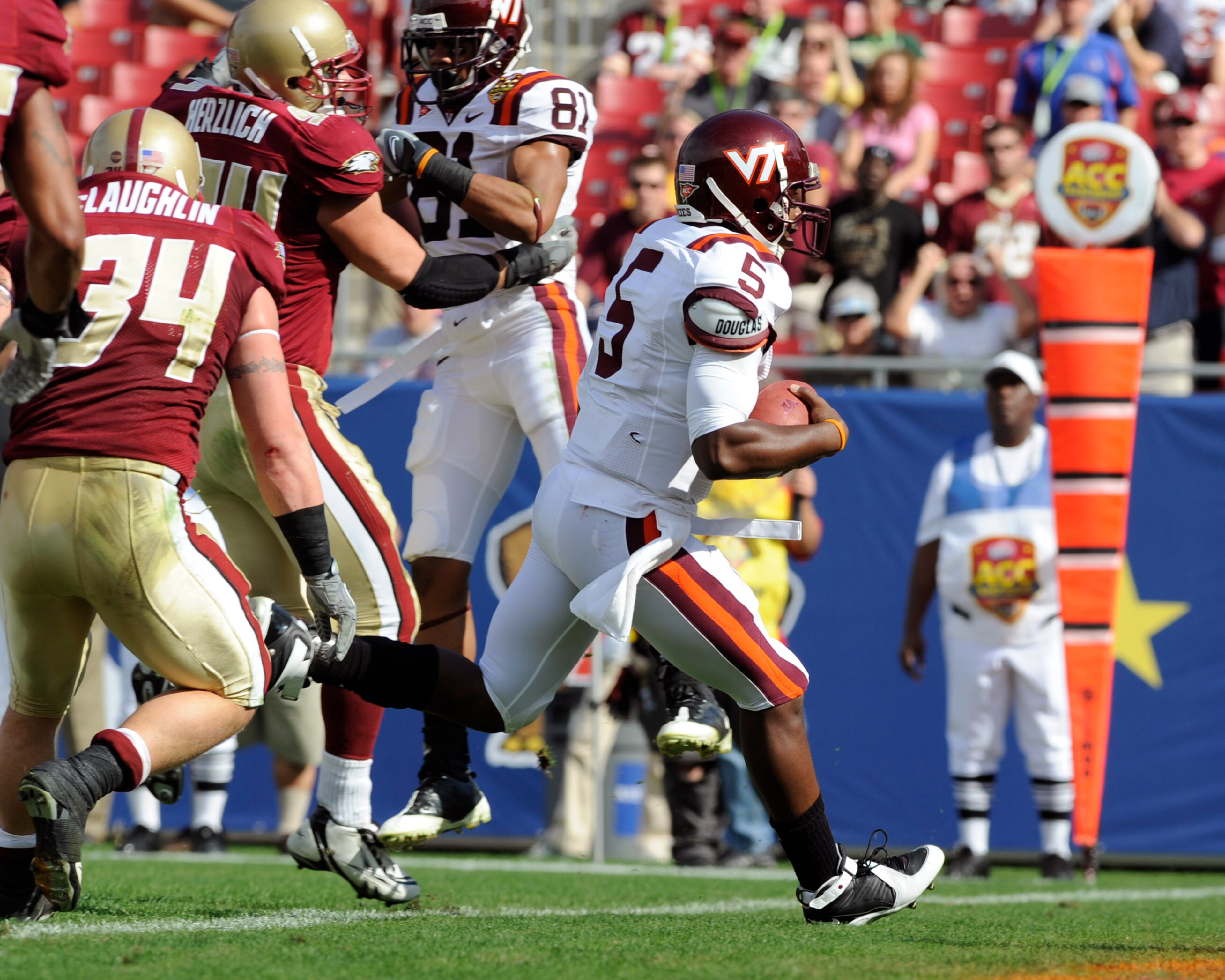 TAMPA, FL - DECEMBER 6: Quarterback Tyron Taylor #5 of the Virginia Tech Hokies runs for a first-quarter touchdown against the Boston College Eagles in the 2008 ACC Football Championship game at Raymond James Stadium on December 6, 2008 in Tampa, Florida.