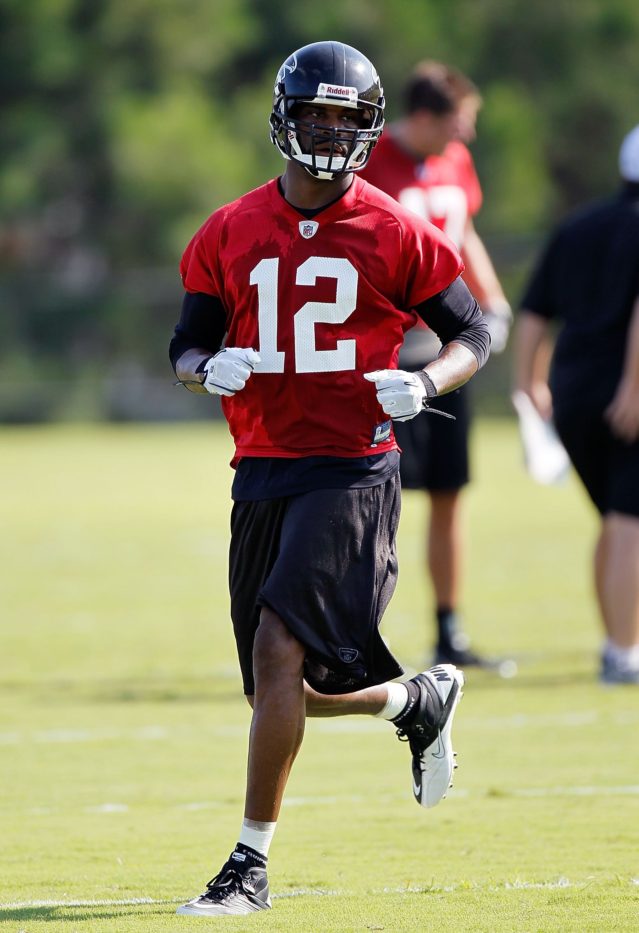 FLOWERY BRANCH, GA - JULY 30:  Michael Jenkins #12 of the Atlanta Falcons runs drills during opening day of training camp on July 30, 2010 at the Falcons Training Complex in Flowery Branch, Georgia.  (Photo by Kevin C. Cox/Getty Images)