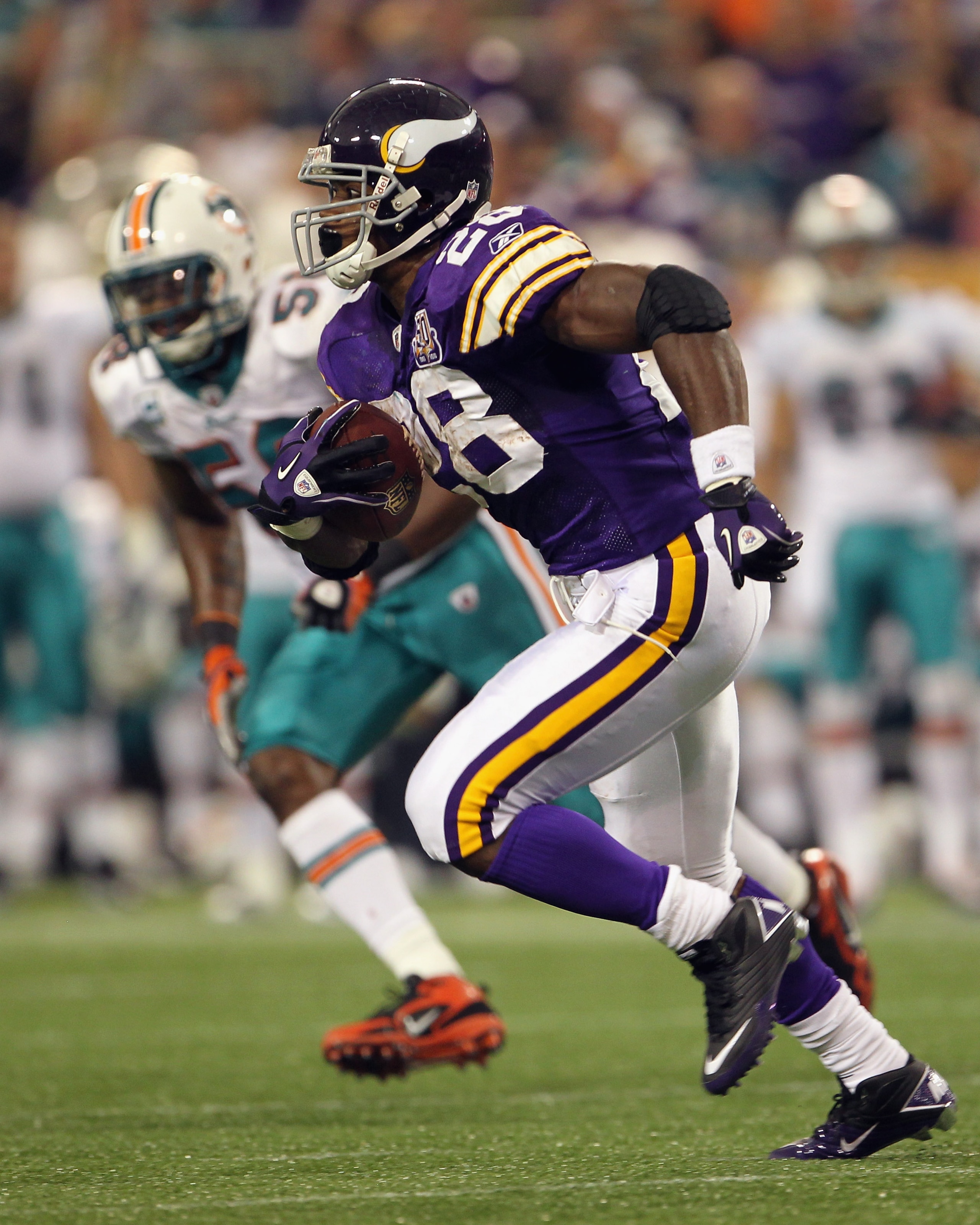 MINNEAPOLIS - SEPTEMBER 19:  Adrian Peterson #28 of the Minnesota Vikings carries the ball during the game against the Miami Dolphins on September 19, 2010 at Hubert H. Humphrey Metrodome in Minneapolis, Minnesota.  (Photo by Jamie Squire/Getty Images)