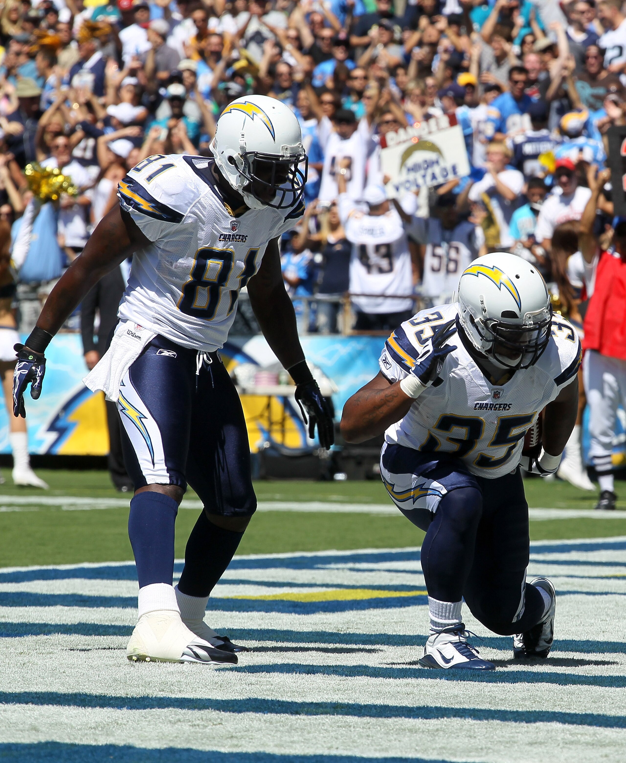 SAN DIEGO - SEPTEMBER 19:  Running back Mike Tolbert #35 and tight end Randy McMichael #81 of the San Diego Chargers celebrate Tolbert's first quarter touchdown run against the Jacksonville Jaguars at Qualcomm Stadium on lbSeptember 19, 2010 in San Diego,