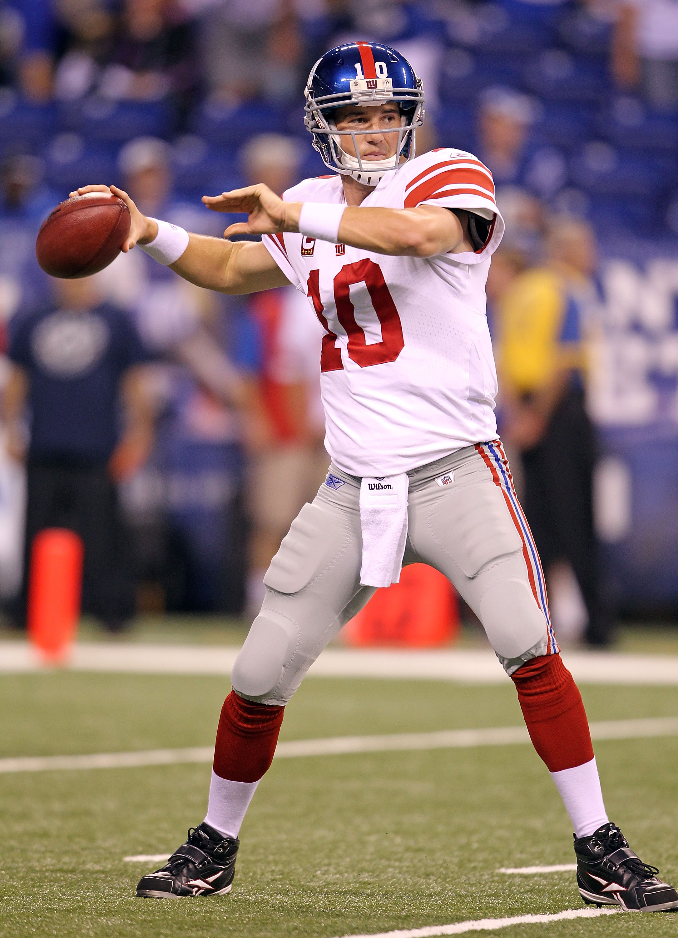 INDIANAPOLIS - SEPTEMBER 19:  Eli Manning #10  of the New York Giants throws a pass during  warmups before the NFL game against the Indianapolis Colts at Lucas Oil Stadium on September 19, 2010 in Indianapolis, Indiana.  (Photo by Andy Lyons/Getty Images)