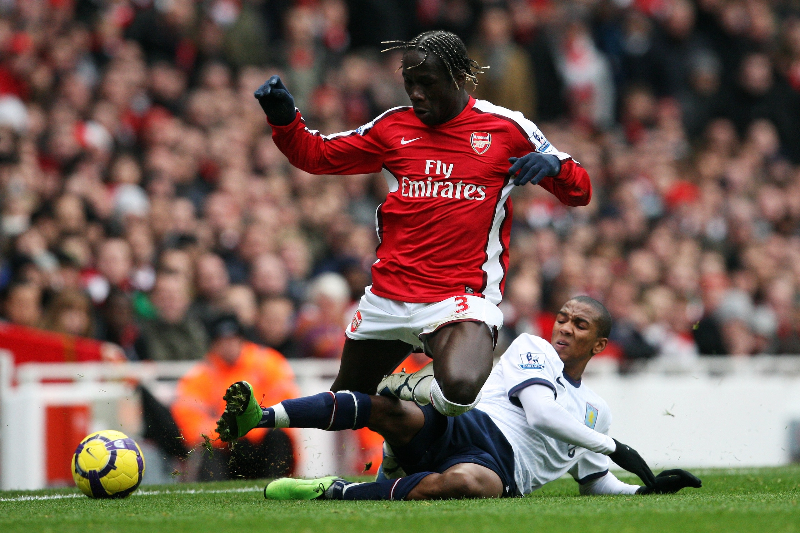 LONDON, ENGLAND - DECEMBER 27:  Bacary Sagna of Arsenal is tackled by Ashley Young of Aston Villa during the Barclays Premier League match between Arsenal and Aston Villa at the Emirates Stadium on December 27, 2009 in London, England.  (Photo by David Ca