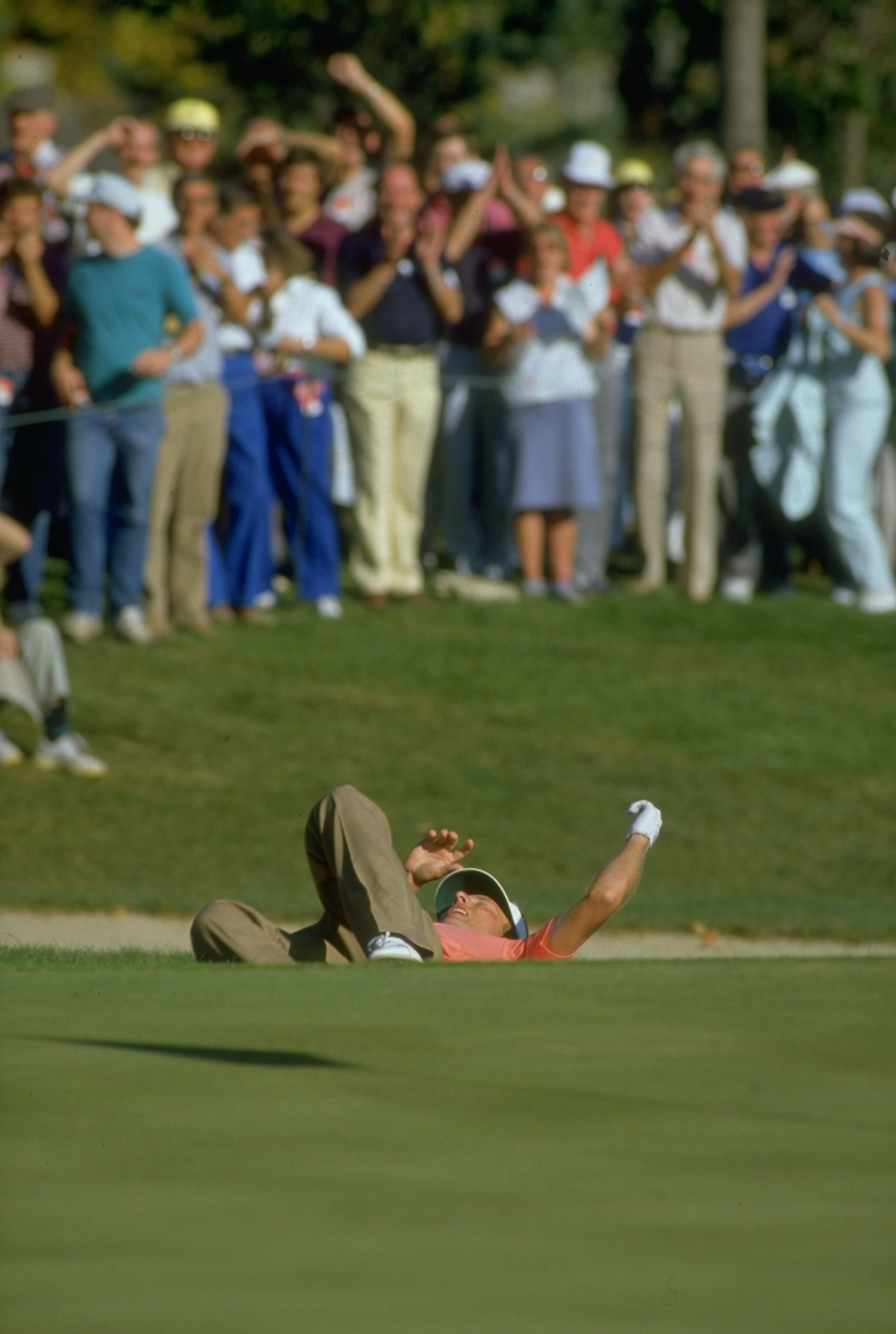 1987:  Bernhard Langer of Germany drops to the ground in elation after sinking a chip shot during the Ryder Cup at Muirfield Village in Ohio, USA. Sandy Lyle and Bernhard Langer beat Larry Nelson and Lanny Wadkins to help Europe win with a score of 15-13.
